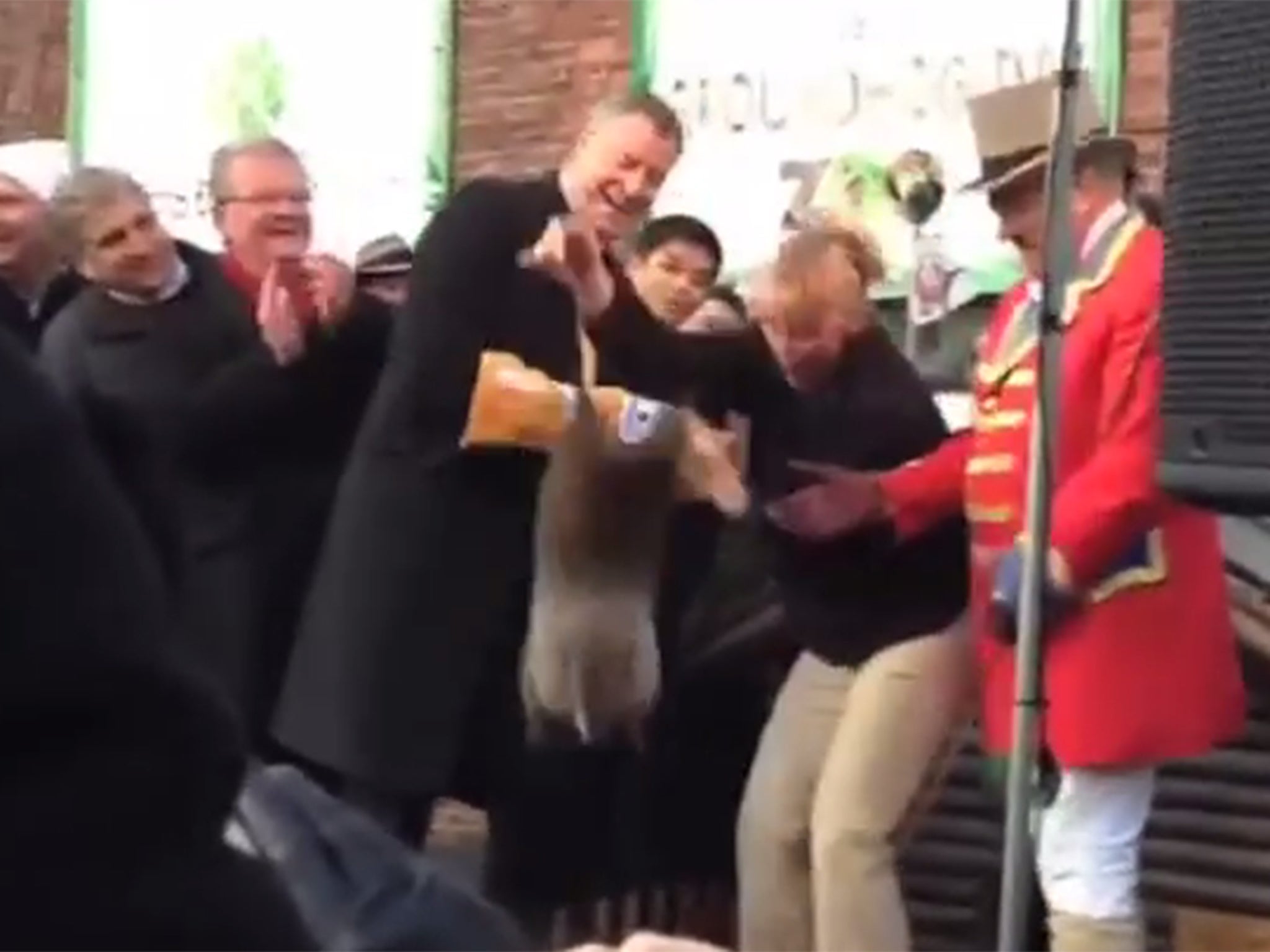 The moment the groundhog fell from the New York mayor's arms