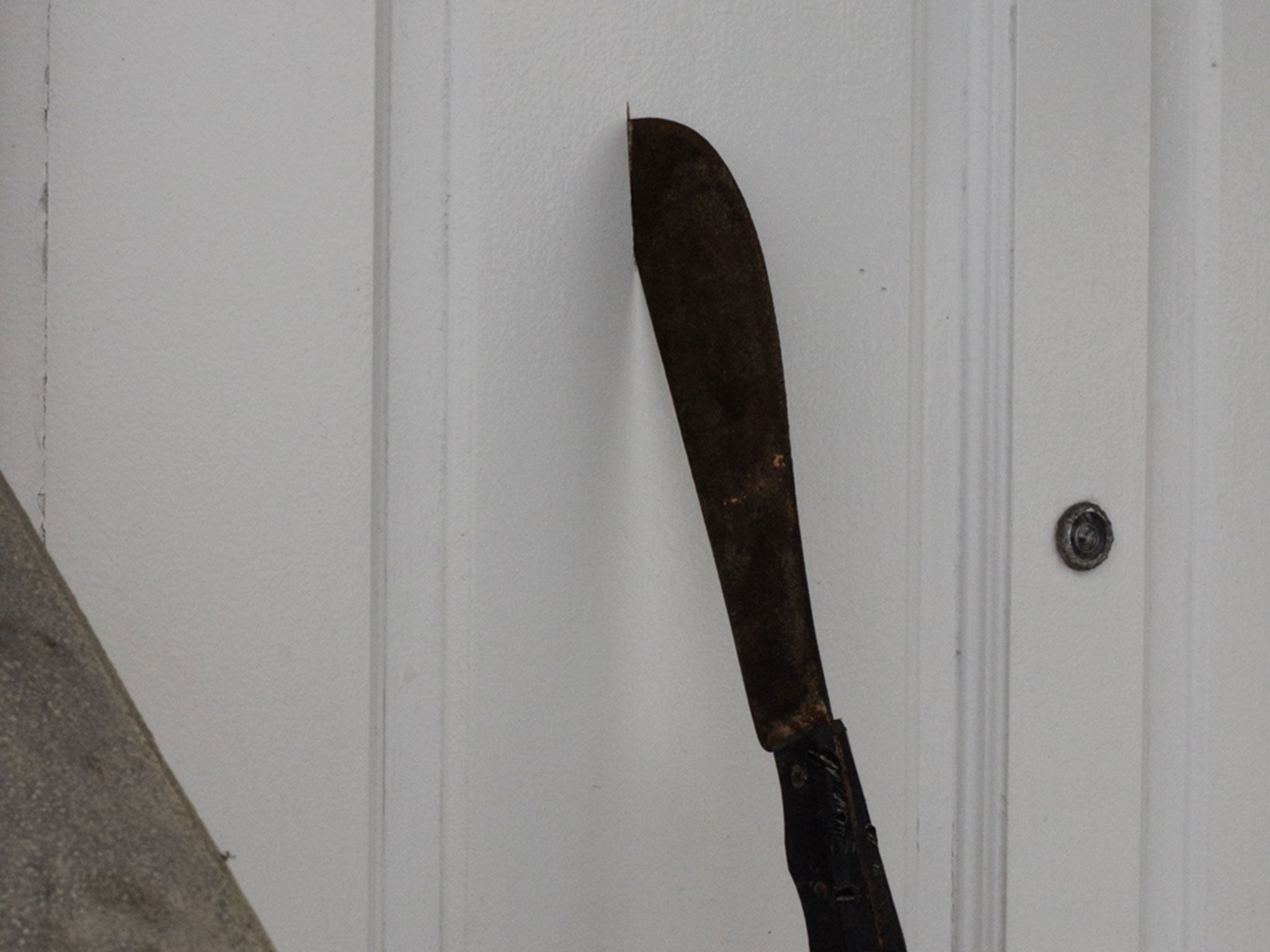 The machete buried in the door of the newspaper office in the Maldives