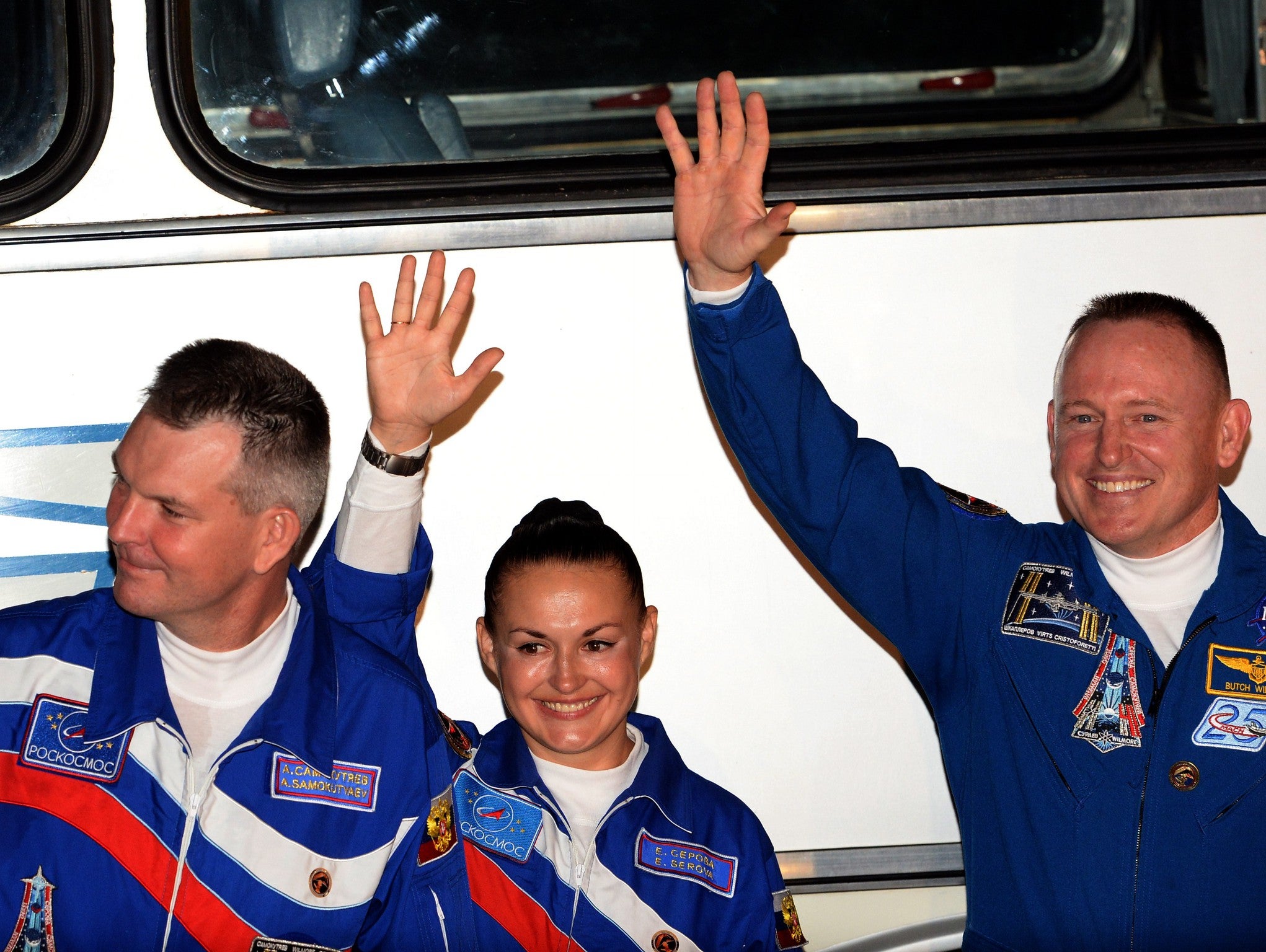 US astronaut Barry Wilmore (R), Russia's cosmonauts Yelena Serova (C) and Alexander Samokutyayev (L)