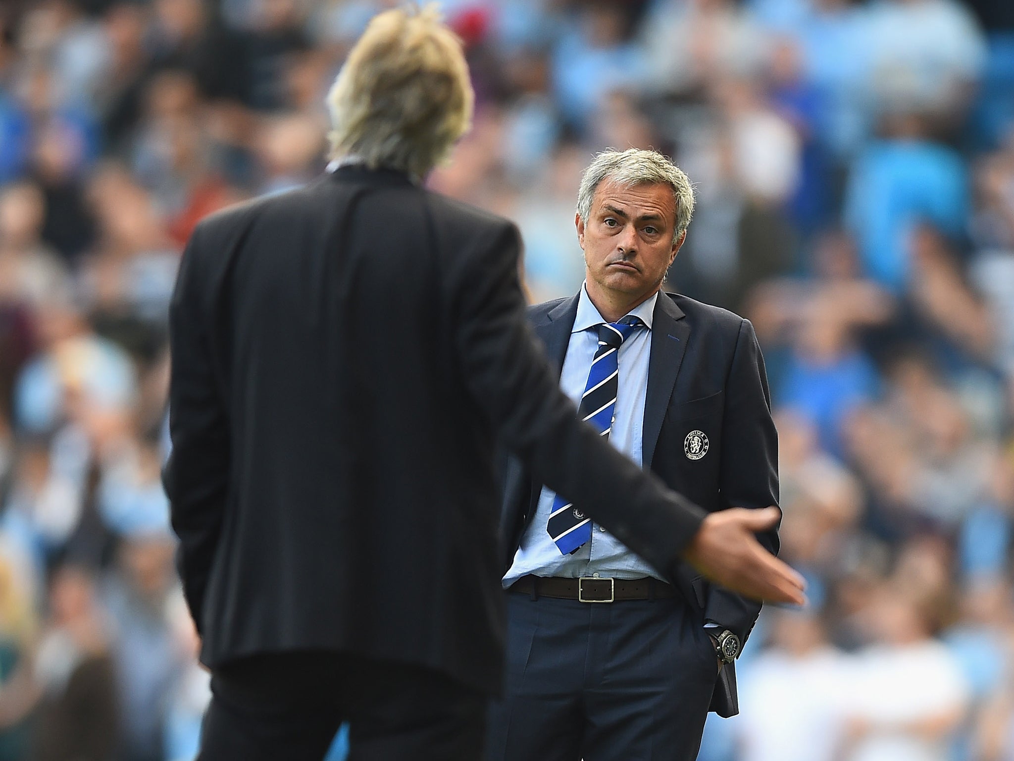 Jose Mourinho of Chelsea speaks with Manuel Pellegrini of Manchester City