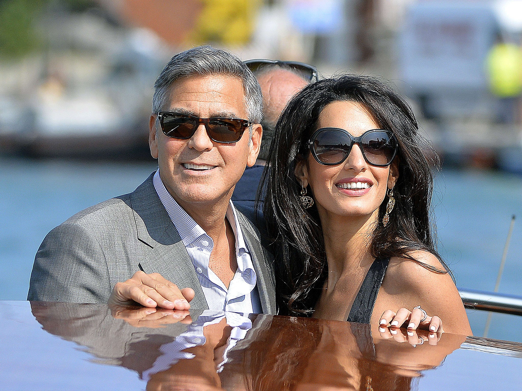George Clooney and his Lebanon-born British fiancée Amal Alamuddin take a water taxi after arriving in Venice
yesterday