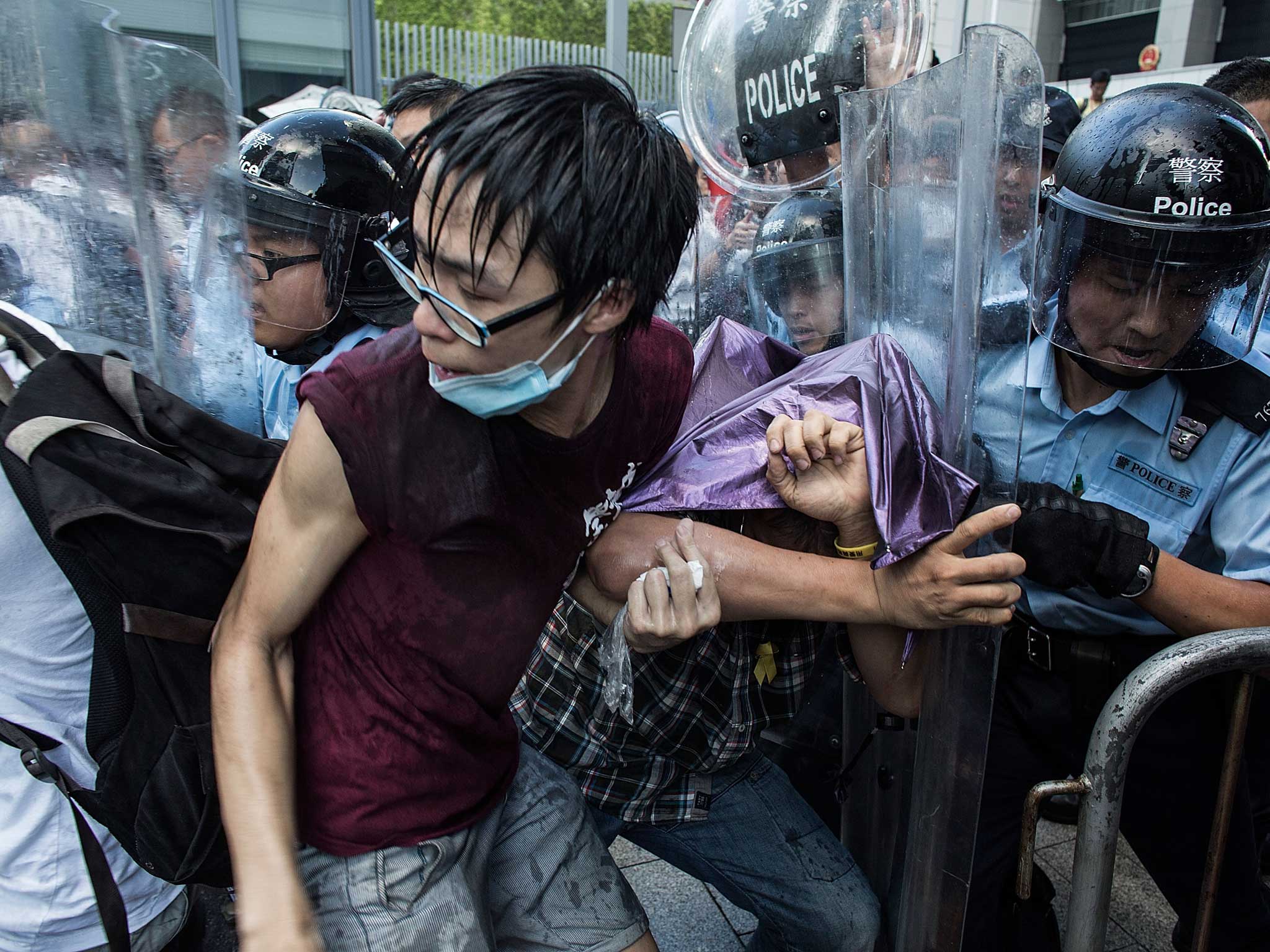 The dispersal followed a night of scuffles between police and about 150 protesters who forced their way into the government compound, some scaling a tall fence