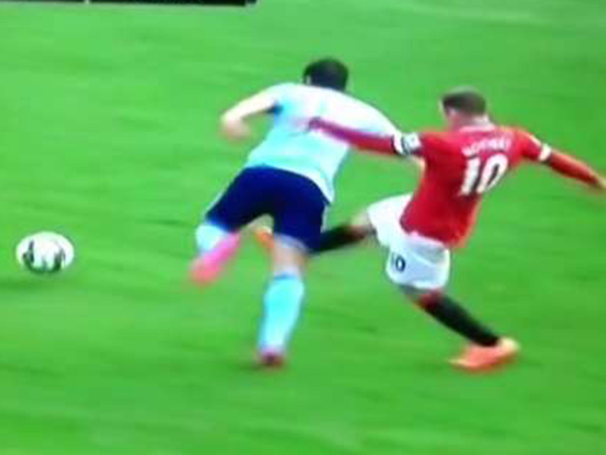 Wayne Rooney kicks out at Stewart Downing