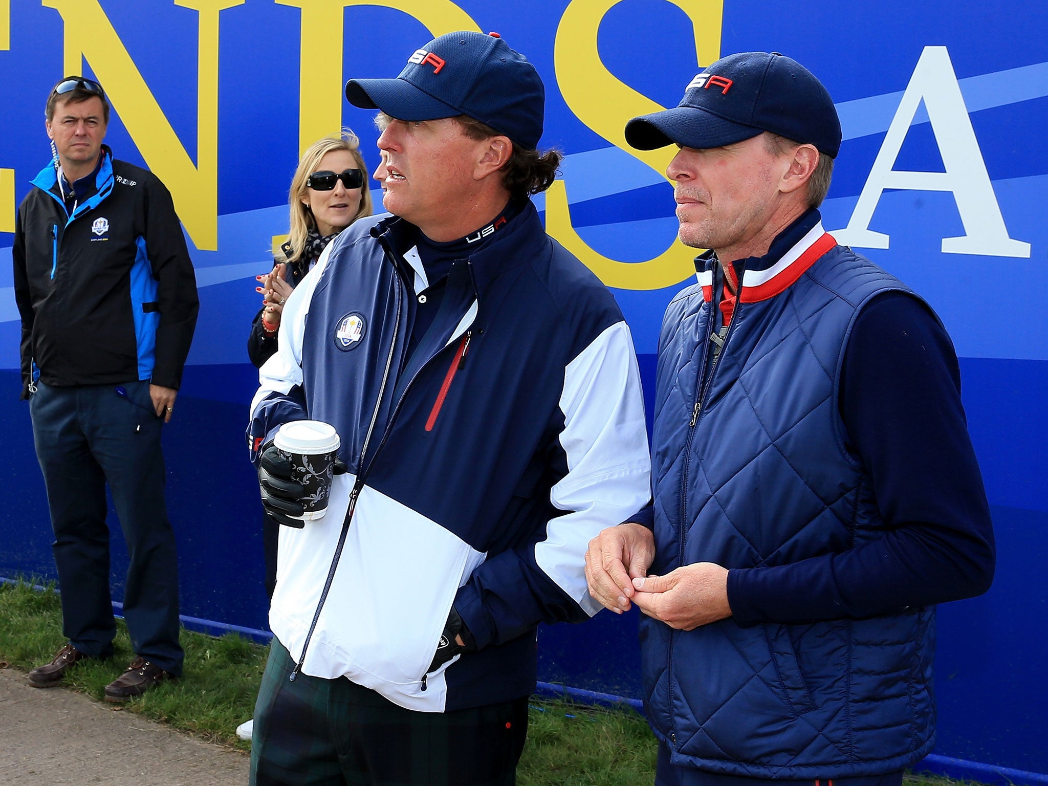 Phil Mickelson speaks with USA vice-captain Steve Stricker