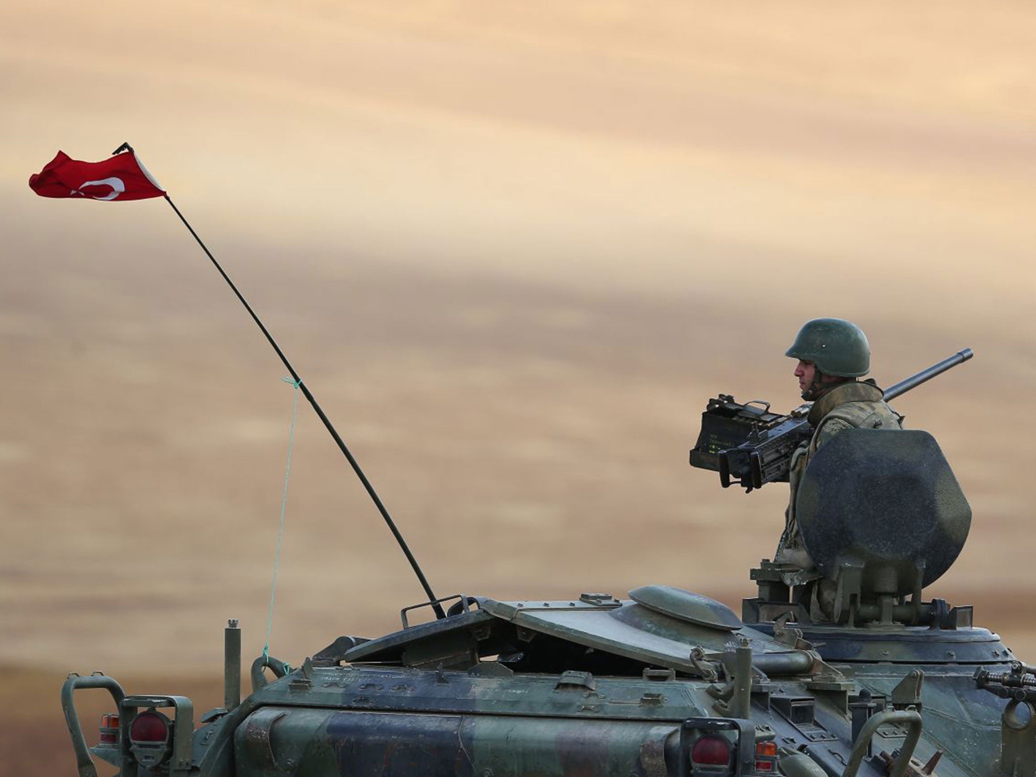 A Turkish soldier guards the border