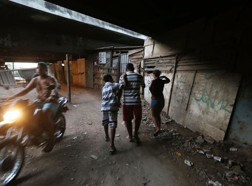 Residents in the impoverished Maré area of Rio 