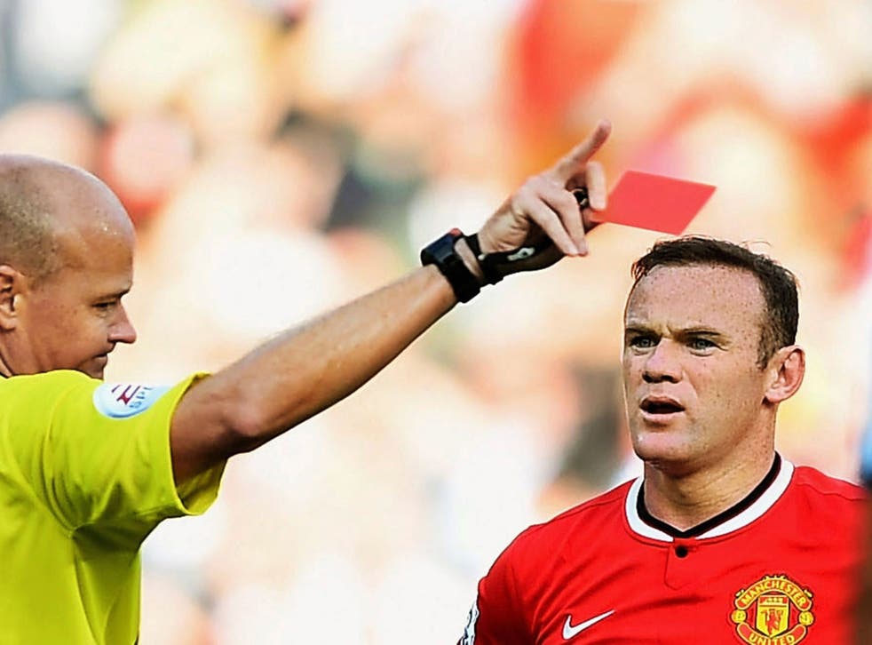 Wayne Rooney is shown a red card by Lee Mason