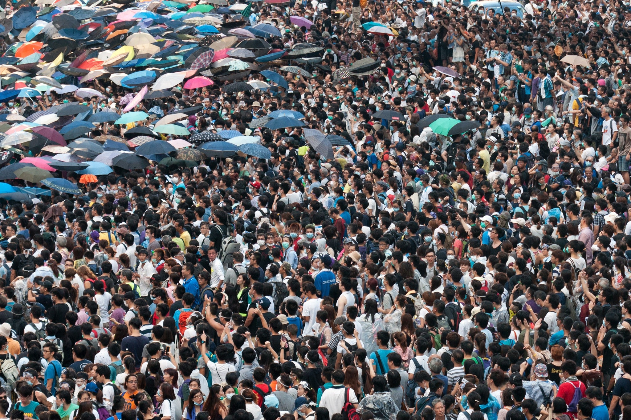 Thousands of demonstrators storm onto a highway after breaking through police cordons during ongoing pro-democracy protests in Hong Kong on 28 September 2014