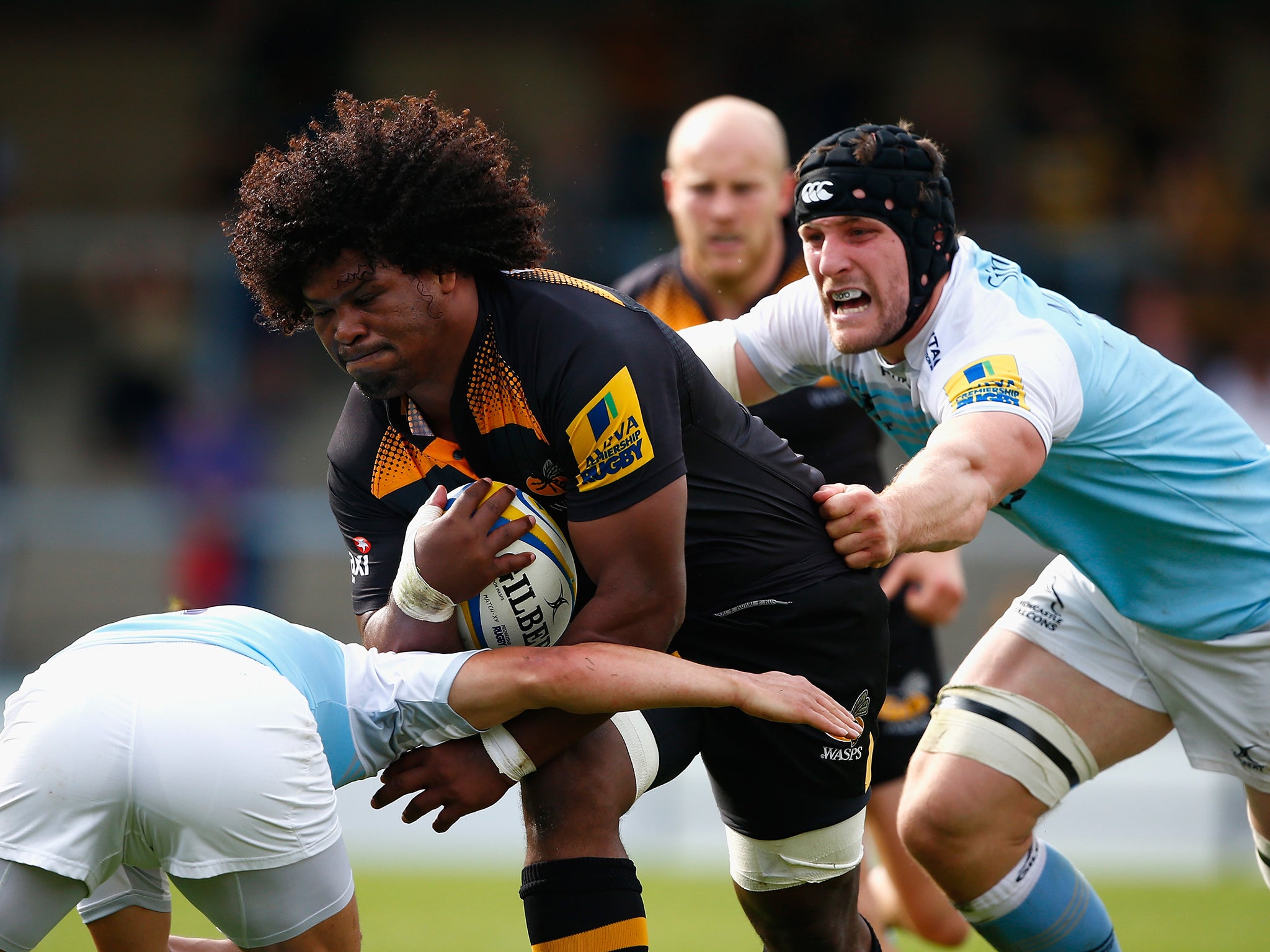 Ashley Johnson of Wasps is tackled by Mark Wilson of Newcastle