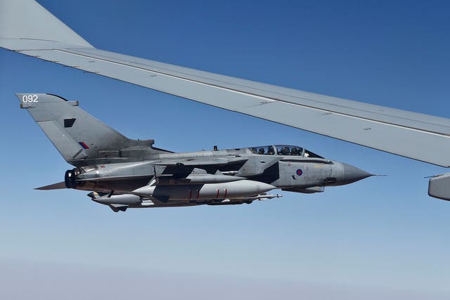 A Tornado GR4 alongside a Voyager refuelling aircraft during the RAF’s first combat mission against Isis in northern Iraq