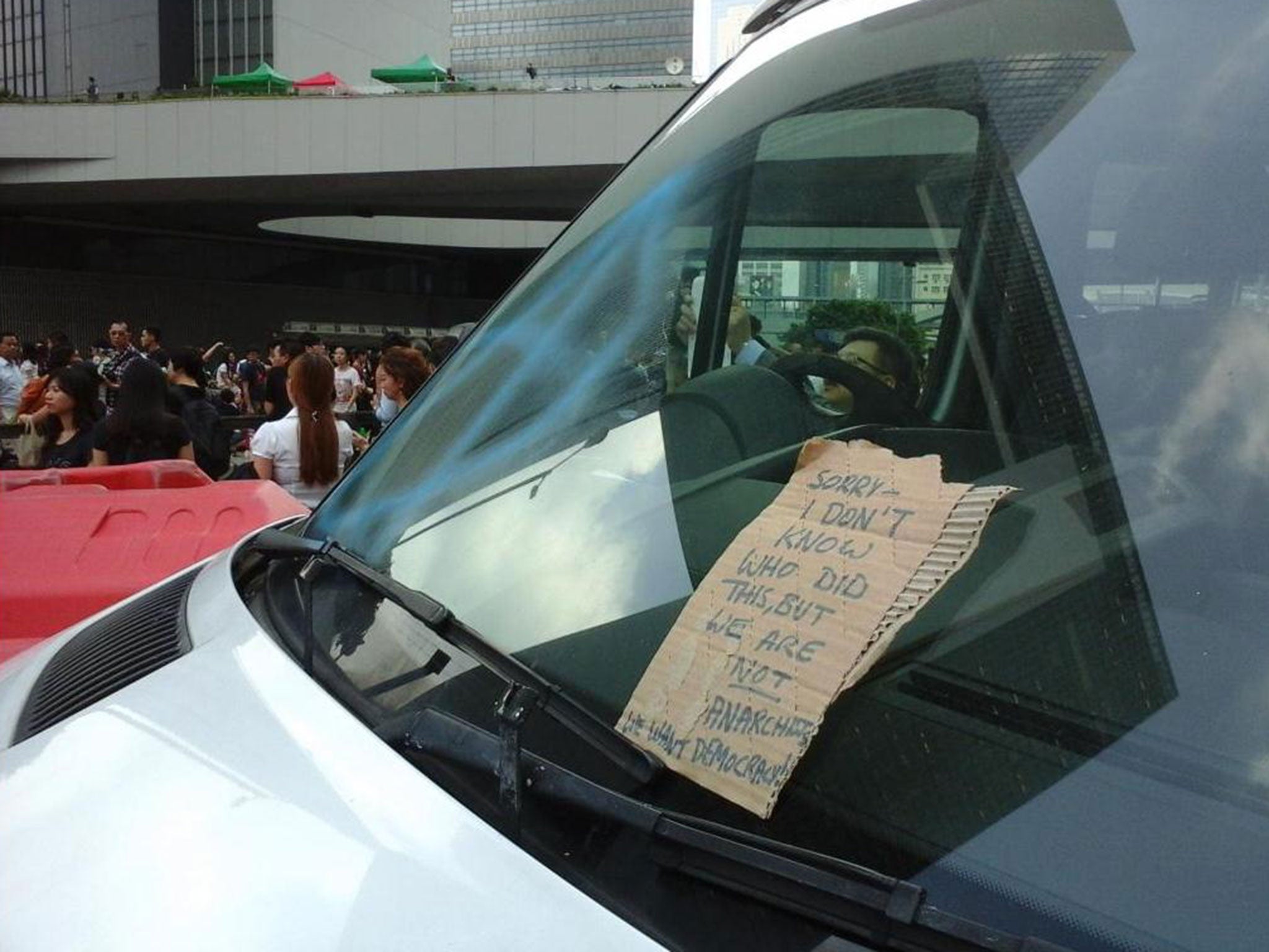 An apology note left on a vandalised police van in Hong Kong