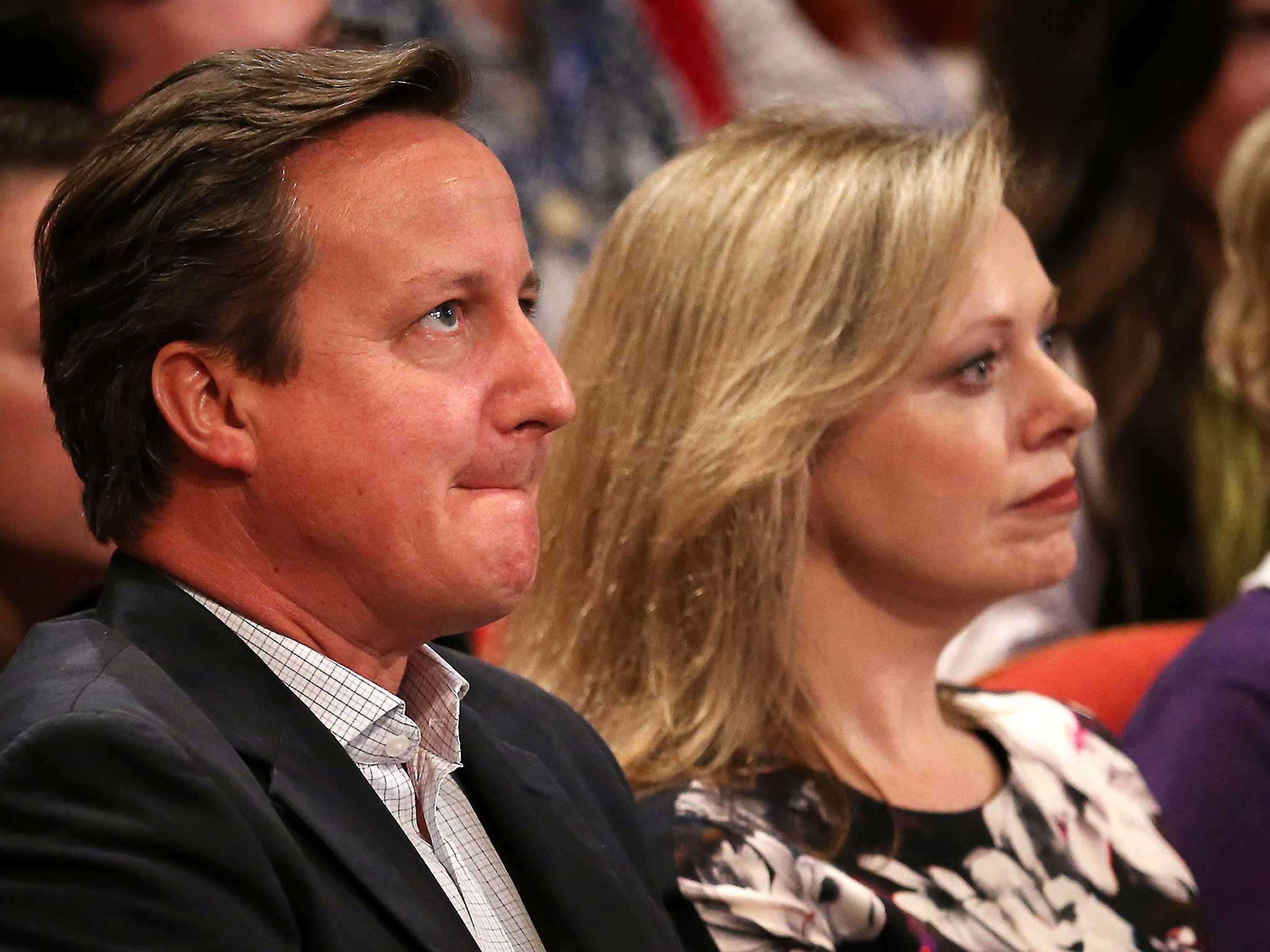 David Cameron sits with Ffion Hague as her husband, Leader of the House of Commons William Hague, addresses the Conservative party conference for the last time in his political career (Peter Macdiarmid/Getty Images)