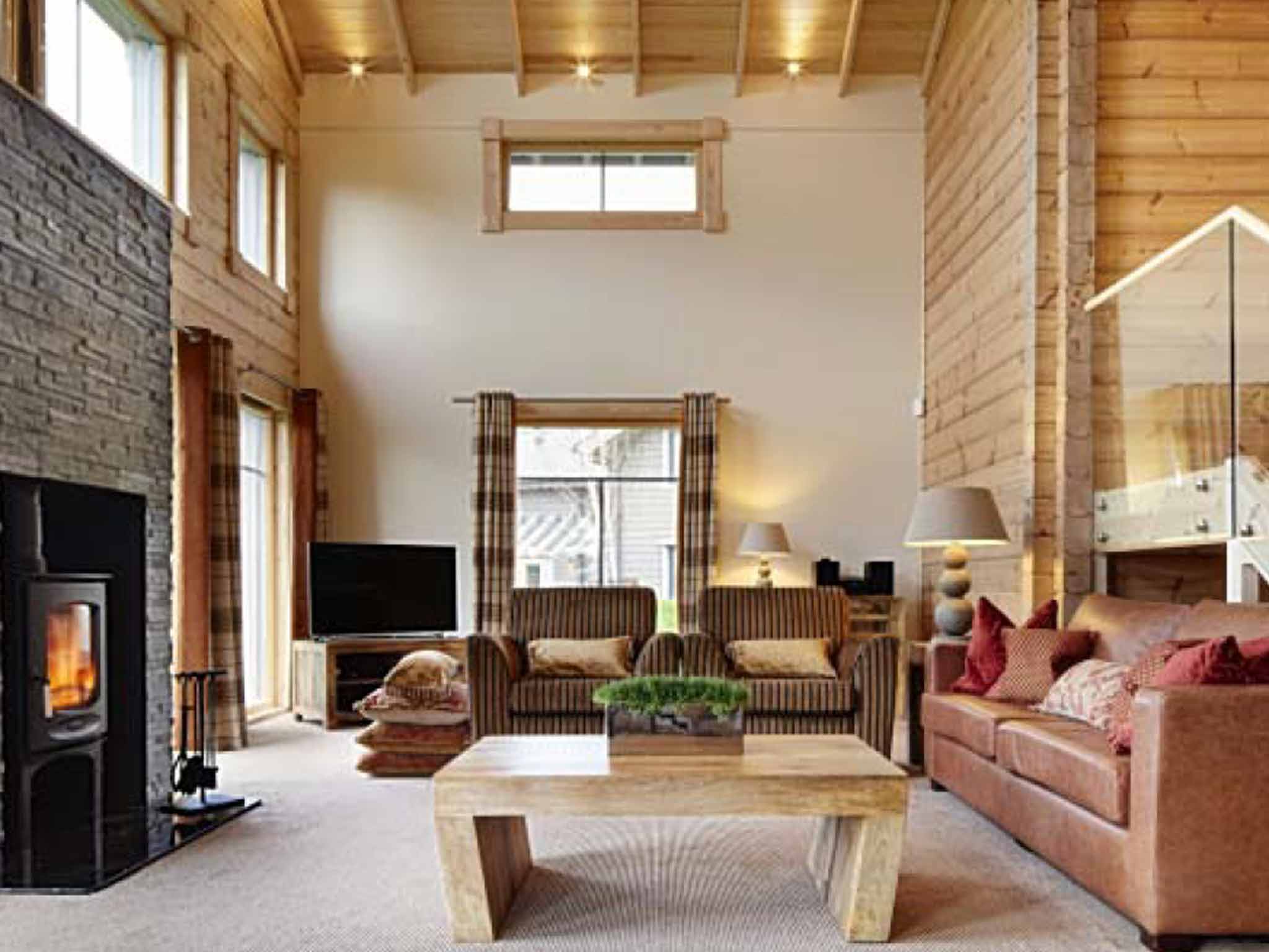 Double height ceilings dominate living spaces