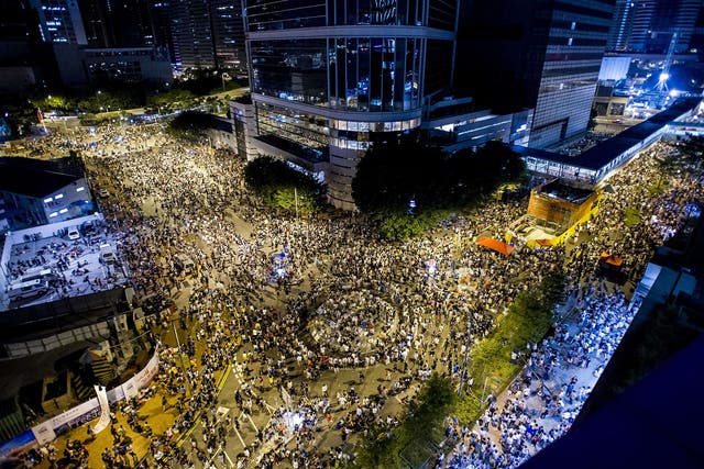 Protesters gather during a demonstration outside headquarters of the Legislative Counsel in Hong Kong 