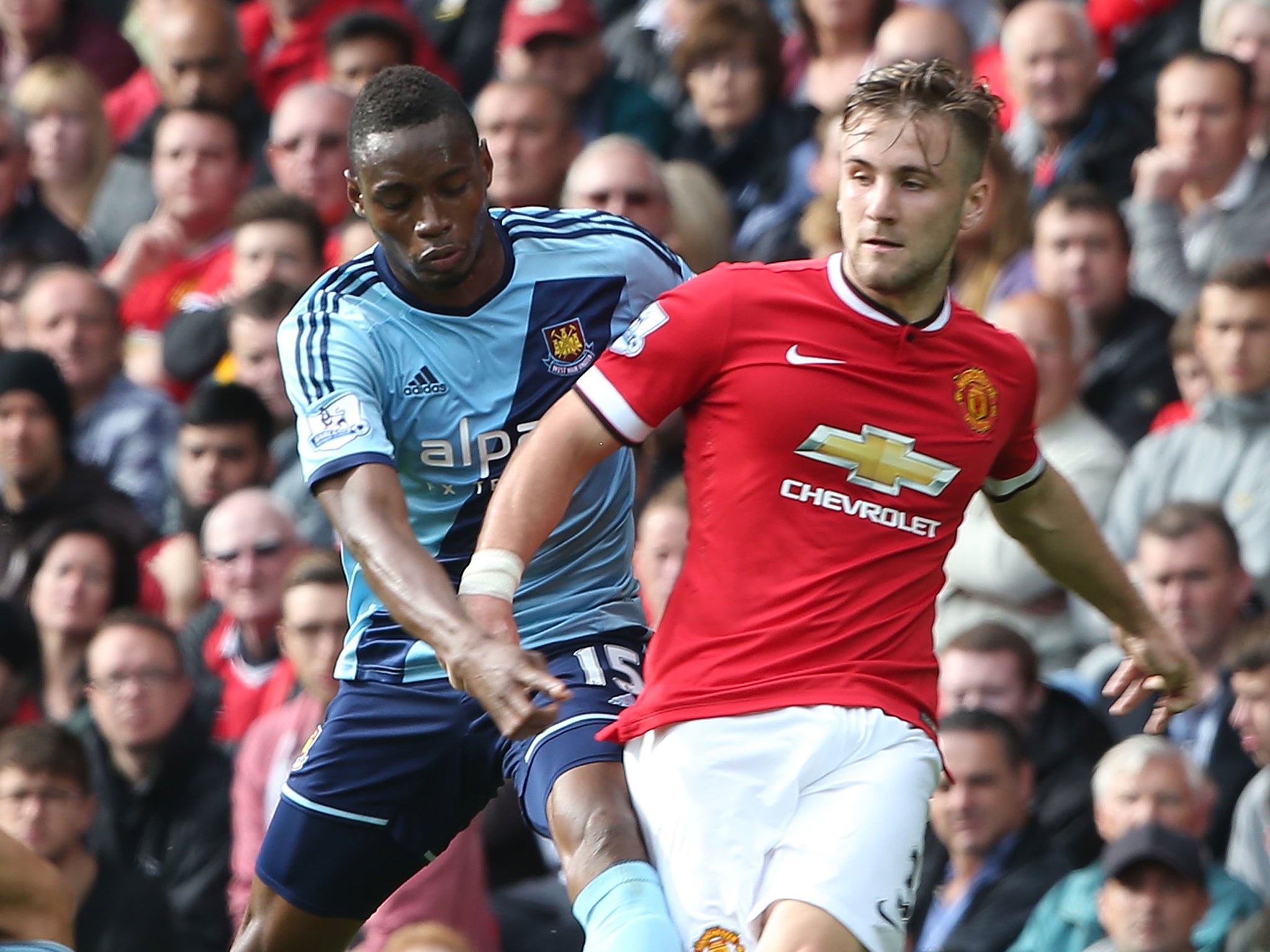 Luke Shaw of Manchester United in action with Diafra Sakho of West Ham