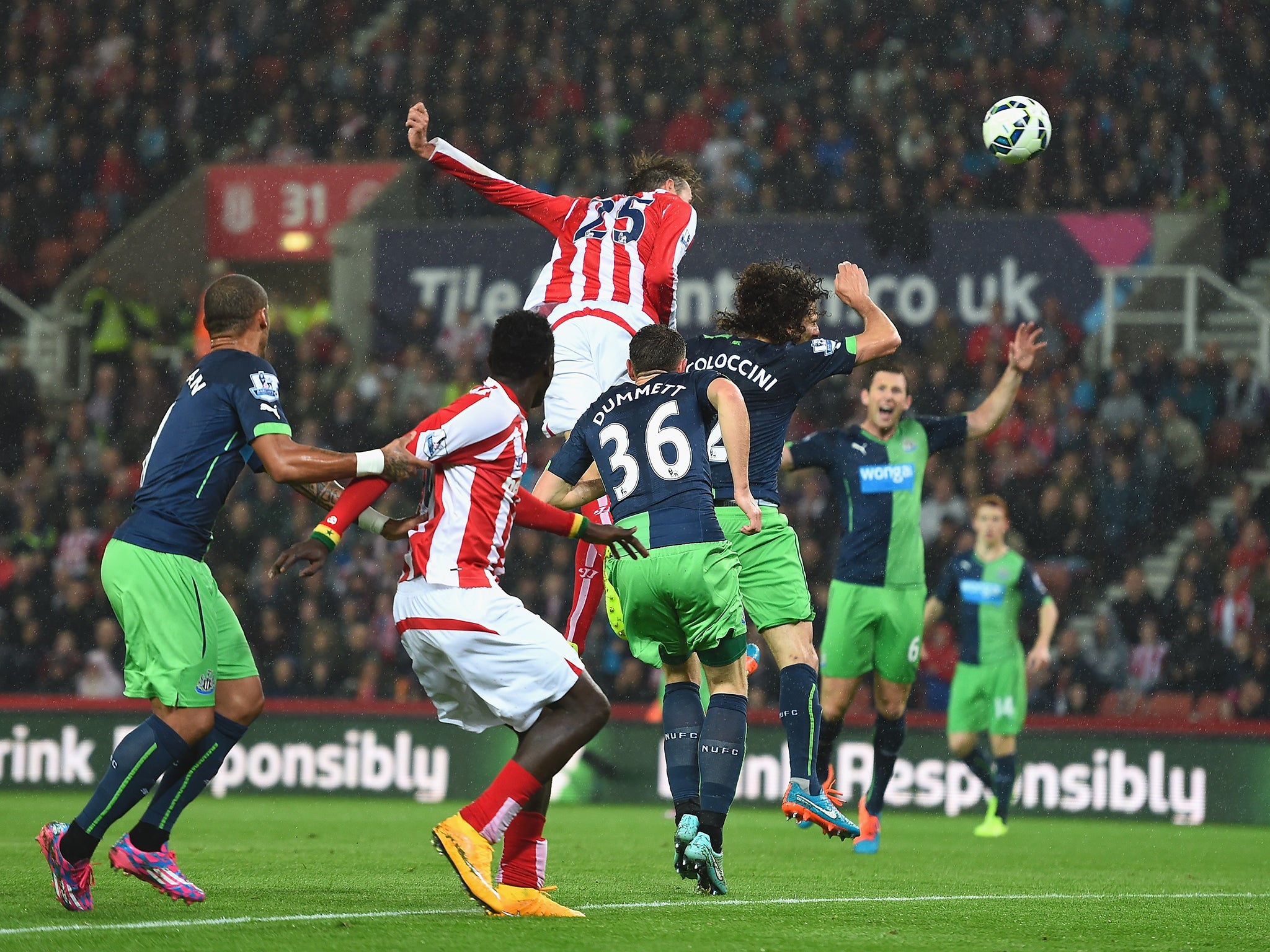 Peter Crouch heads home the opening goal in the game between Stoke and Newcastle