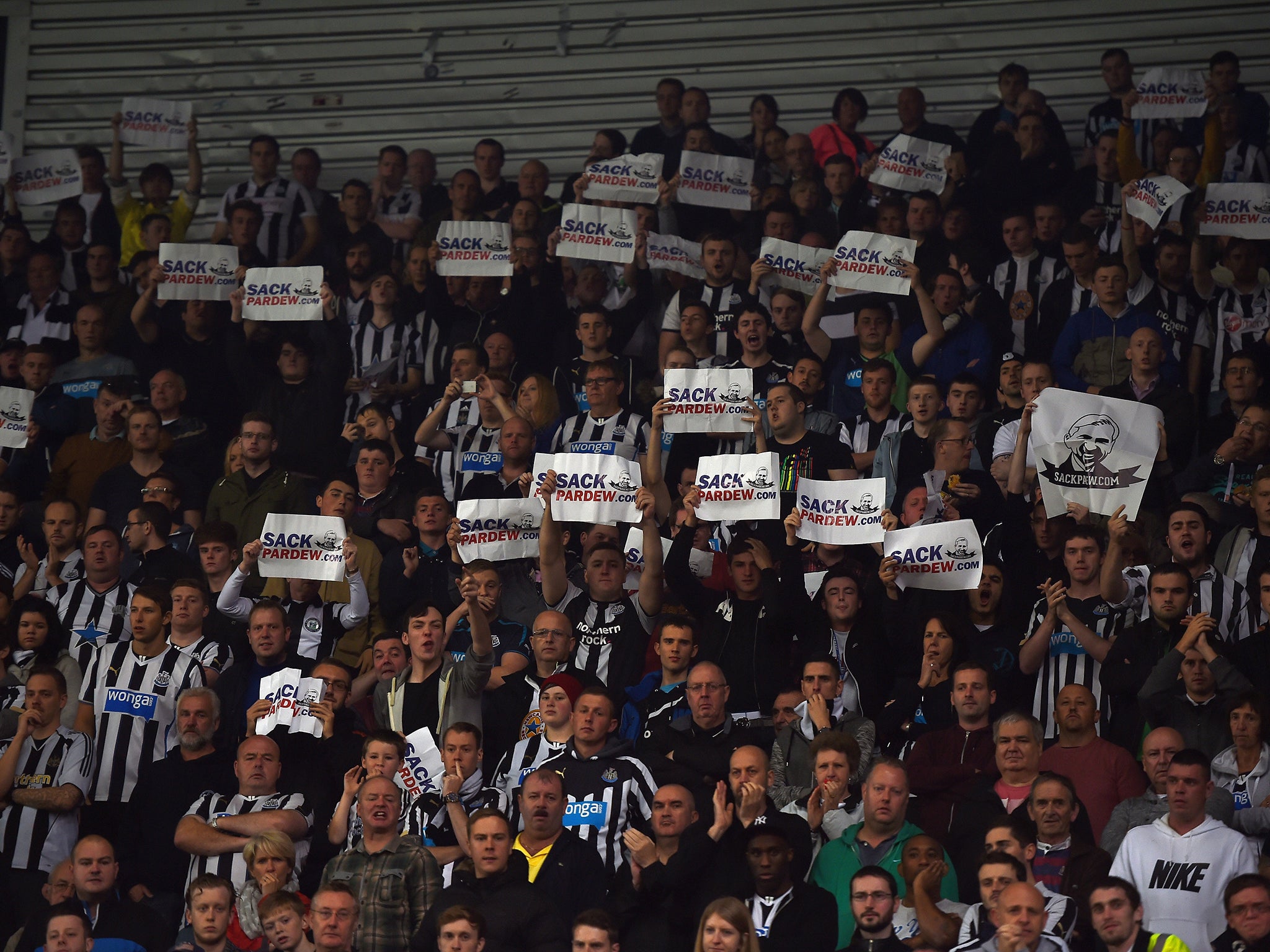 Fans call for the head of Alan Pardew at the match between Newcastle and Stoke