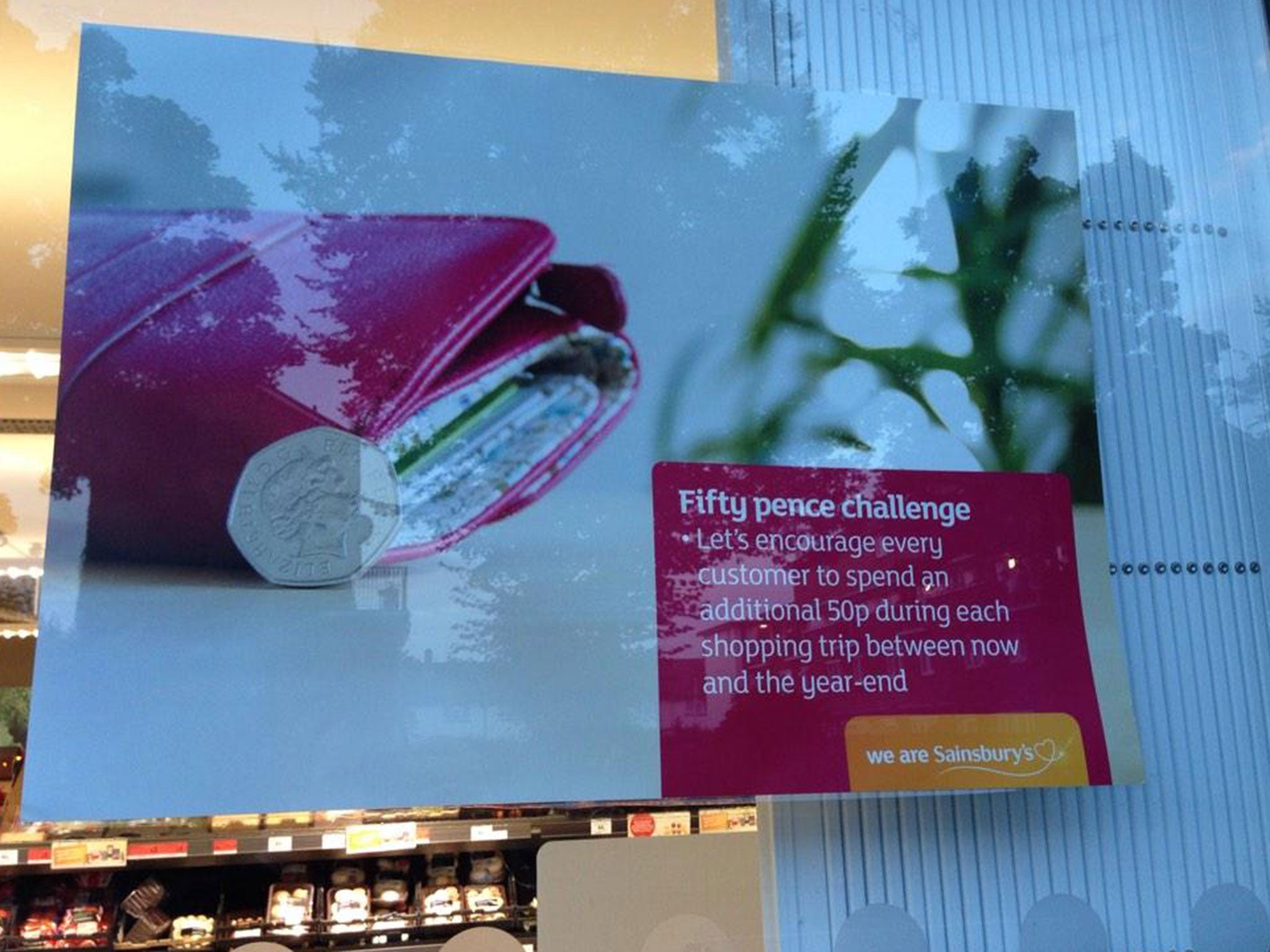 A poster telling staff at Sainsbury’s to encourage customers to spend more was put up in the shop window instead of the staff room by accident