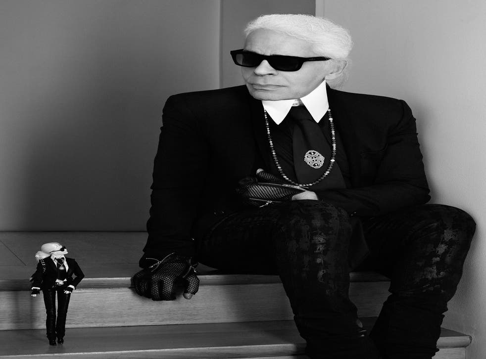 Karl Lagerfeld poses with his lookalike Barbie doll, which sold out in under one hour on net-a-porter