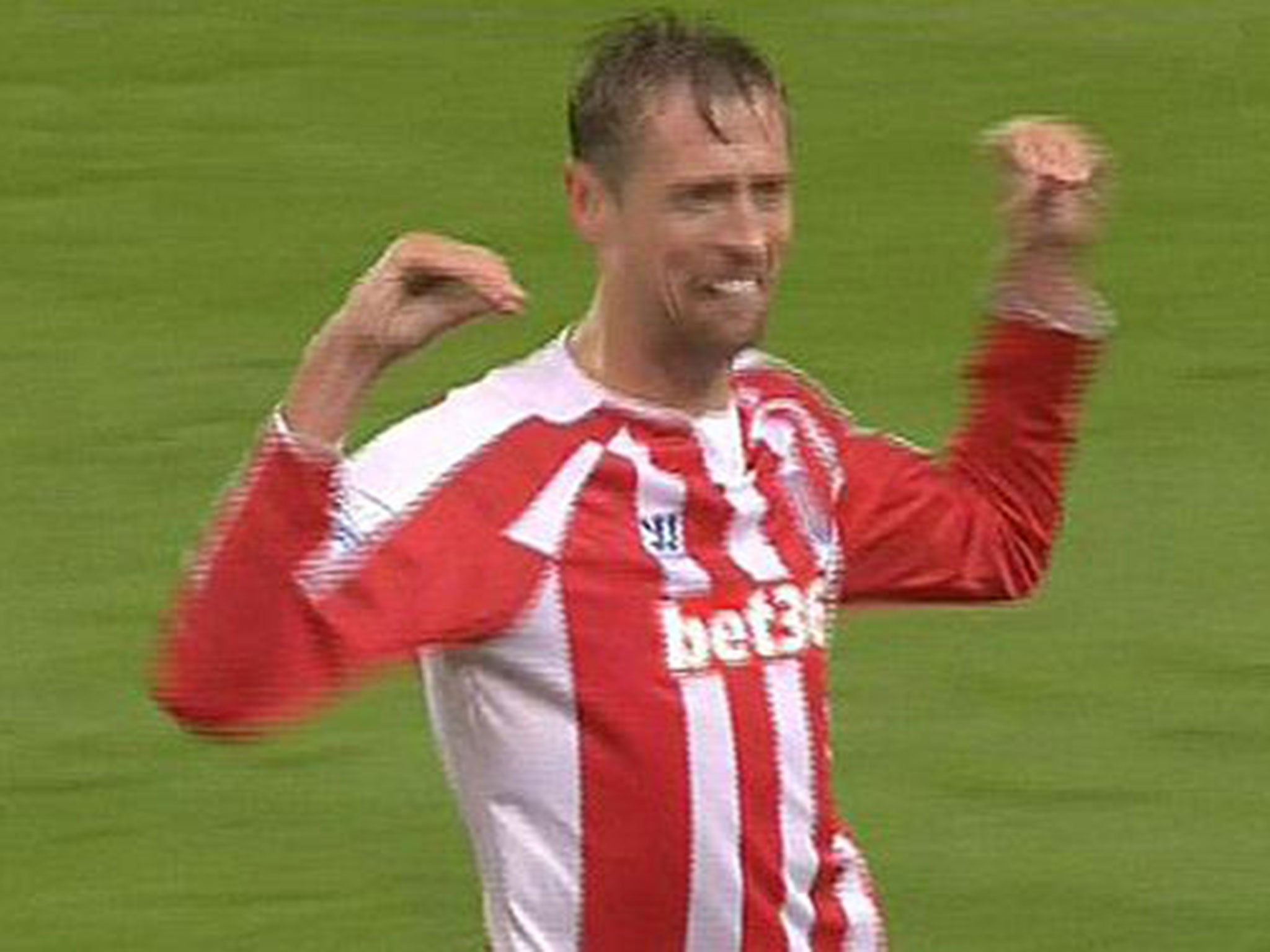 Peter Crouch celebrates his goal with the birdie