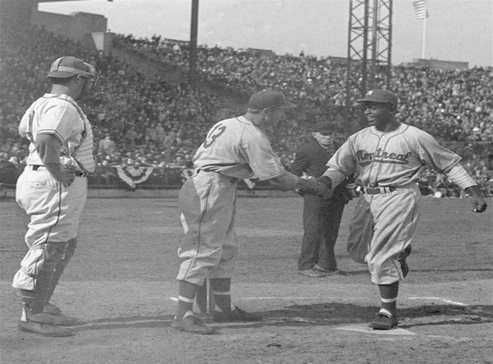 Shuba performs his historic handshake with Jackie Robinson in Jersey City in 1946