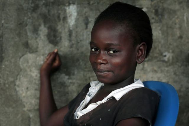 Kumba Fayah, 11, lost both parents and her sister to the Ebola virus and is now living with her extended family. 