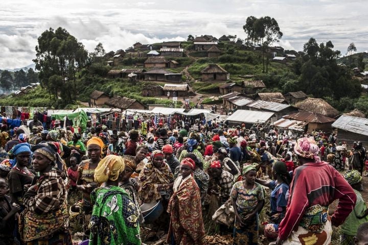 A day to remember in Kivuye, Congo, as residents gather at their market. This return to normality was made possible by government forces driving militia from the village