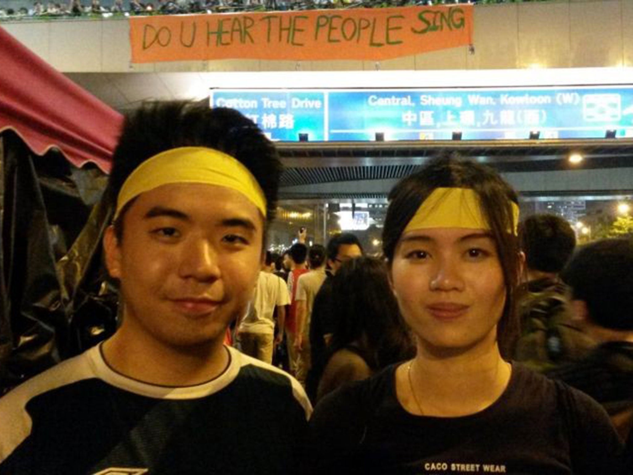 James Fong and Chloe Wong distributed yellow ribbons – a symbol for the struggle – to protesters