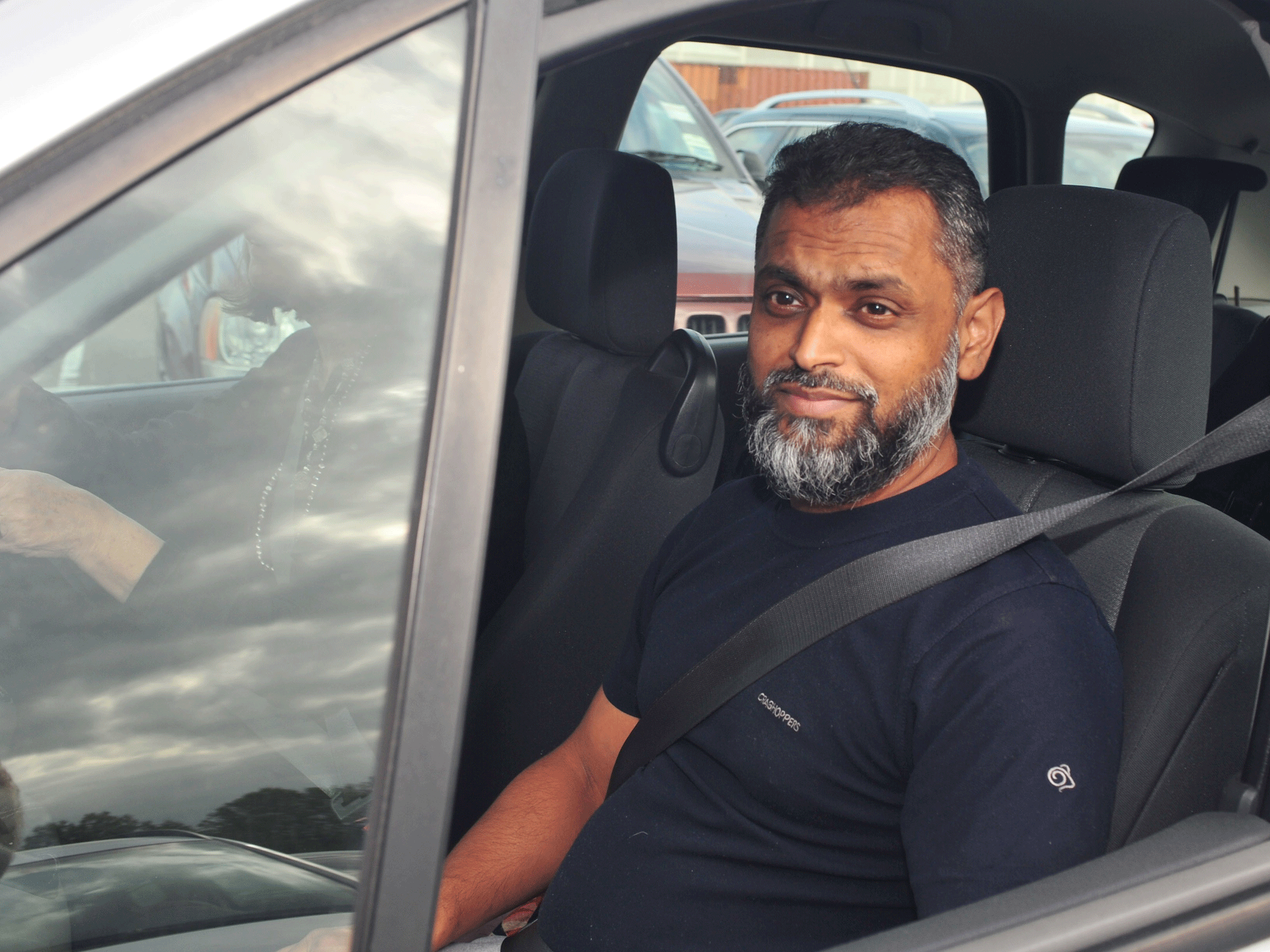 Moazzam Begg is driven away from Belmarsh prison, south London, after he walked from jail when a string of terrorist charges linked to the civil war in Syria were dramatically dropped