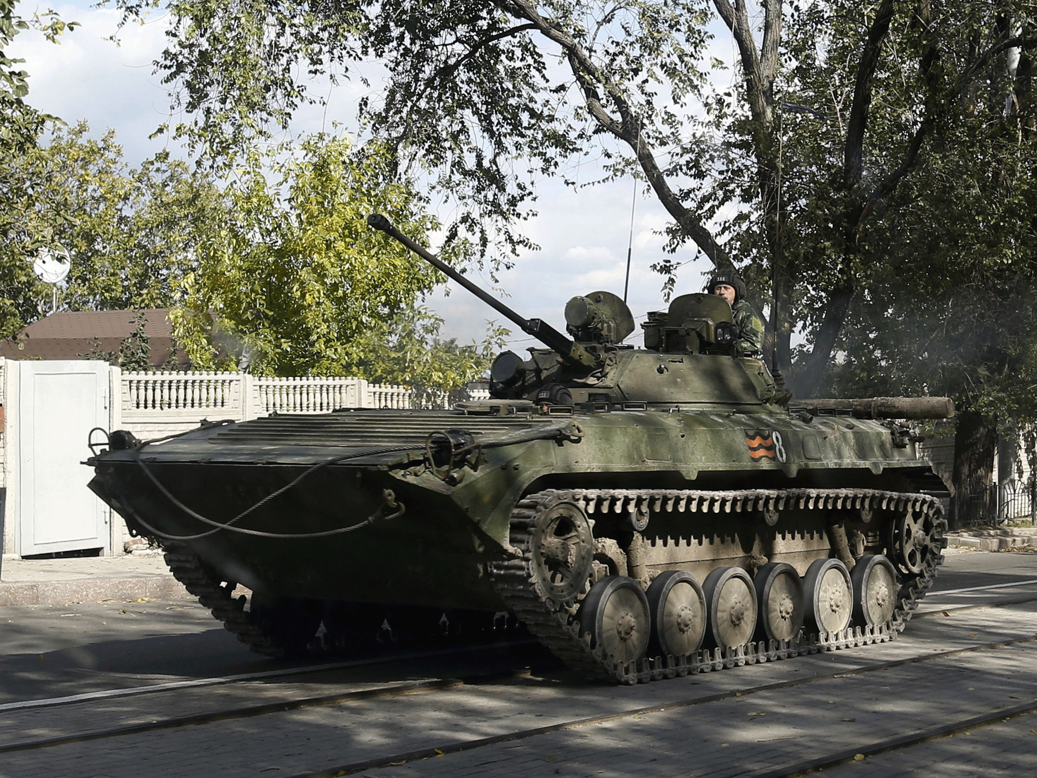 An armored personal carrier makes its way through the town of Donetsk, eastern Ukraine, on Wednesday, October 1