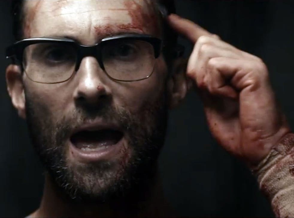 Adam Levine plays a butcher who obsessively stalks a woman in Maroon 5's 'Animals' music video