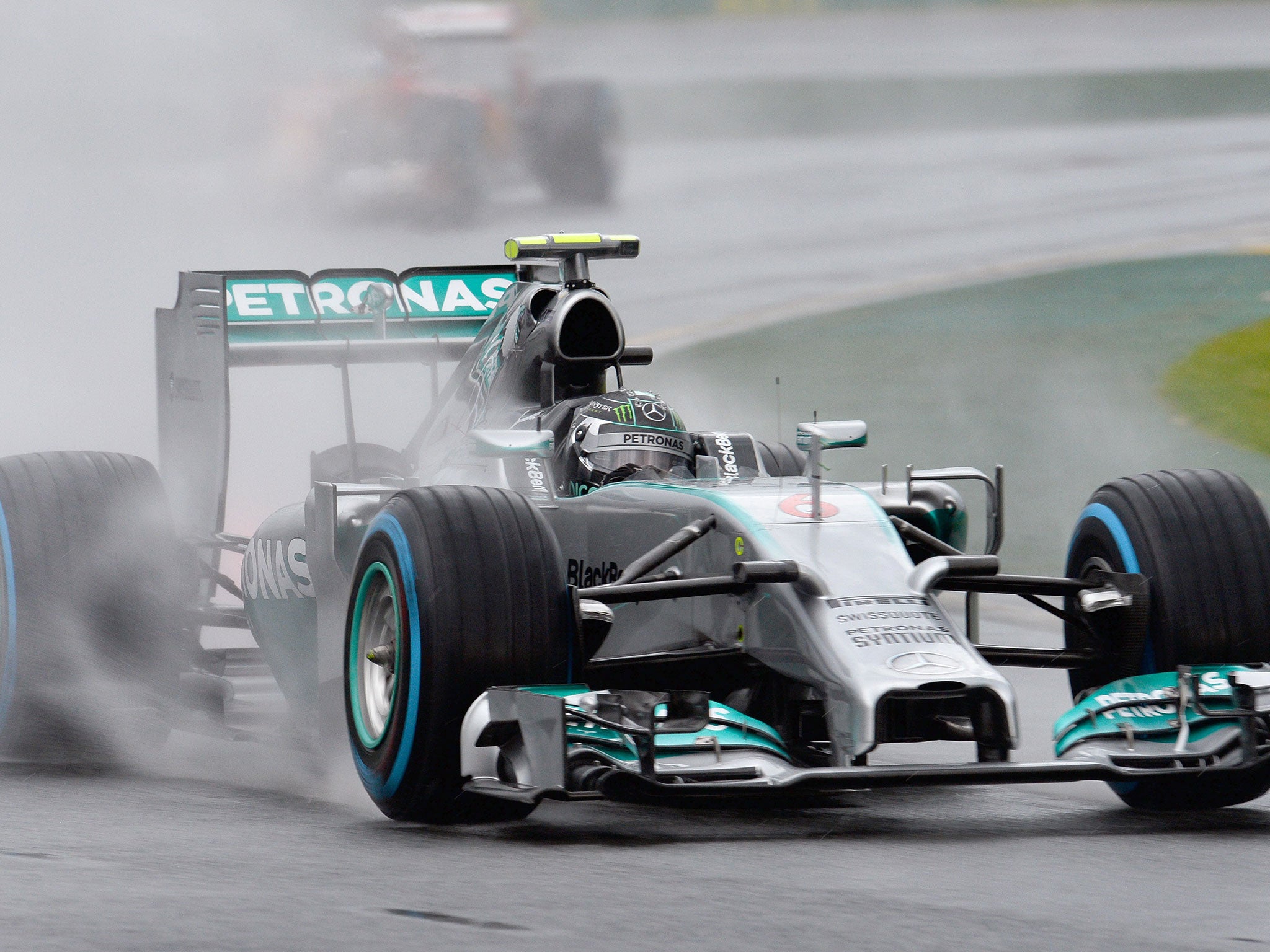 Nico Rosberg drives through the rain