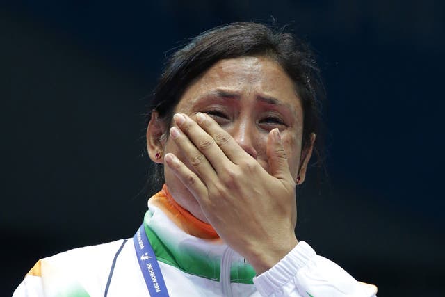 L Sarita Devi of India cries after she refused her bronze medal 