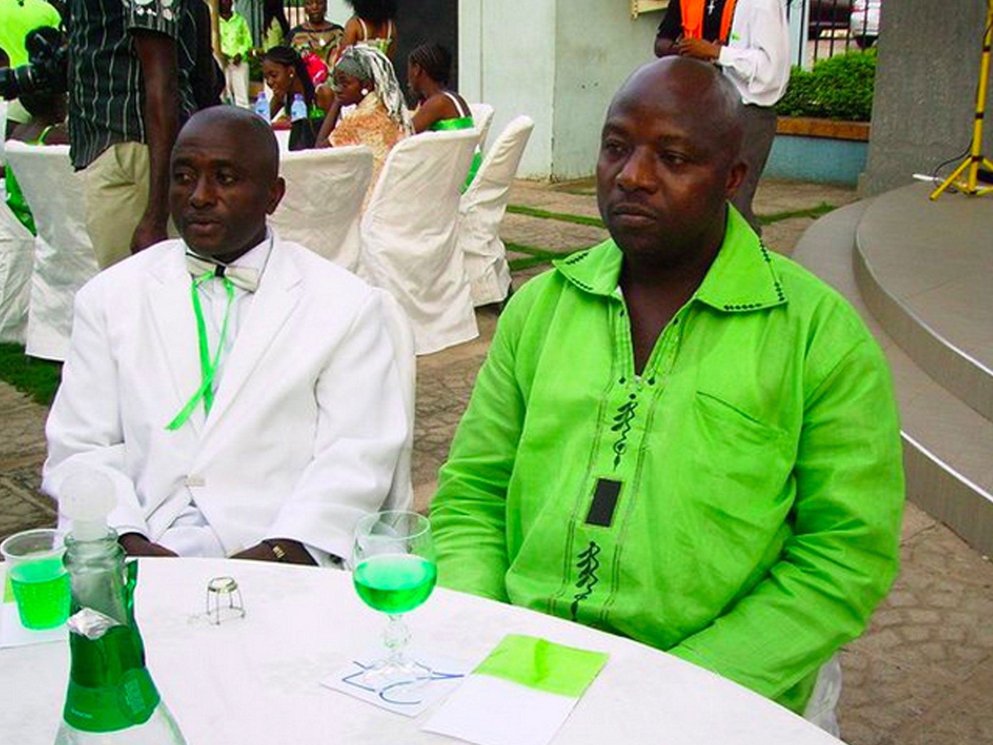 Thomas Eric Duncan, right, with a friend at a wedding in Ghana. Duncan has been kept in isolation at a hospital since Sunday