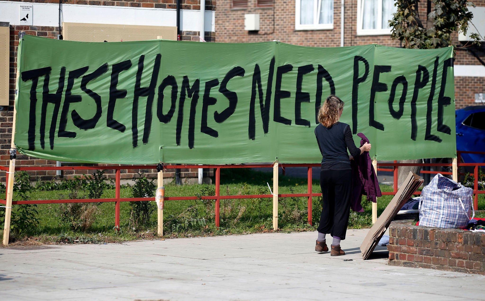 Demonstrators protest against Newham Council's plans to demolish the Carpenter housing estate in Stratford