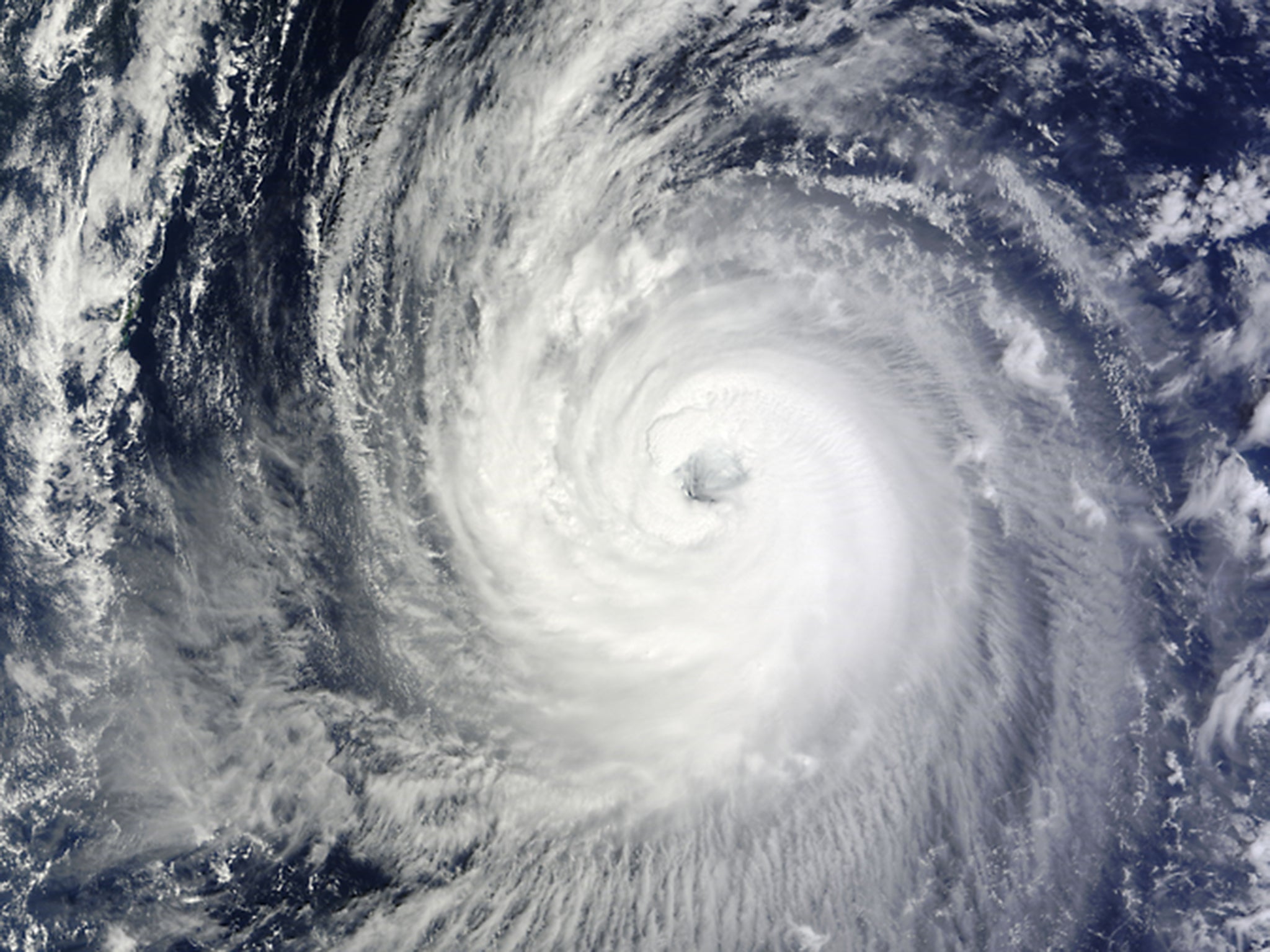Nasa satellite images show Typhoon Phanfone as it makes its way north-westwards towards the eastern coast of southern Japan