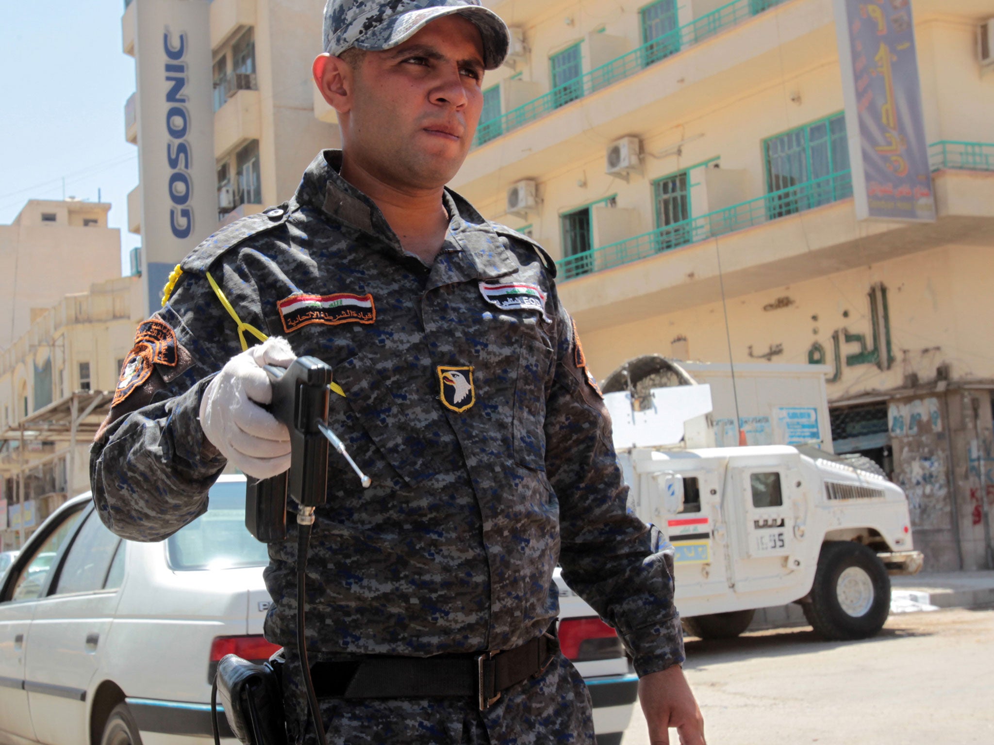 Similar fake bomb detectors have also been used by police in Iraq, shown here doing checks in Baghdad in 2012