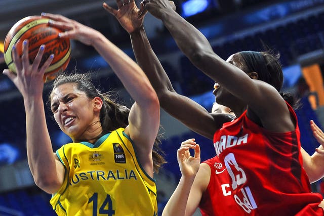 Australia's Marianna Tolo (L) vies for the ball with Canada's Tamara Tatham (R) during the 2014 FIBA Women's World Championships quarter-final basketball match between Australia and Canada at Fenerbahce Ulker Sports Arena in Istanbul 