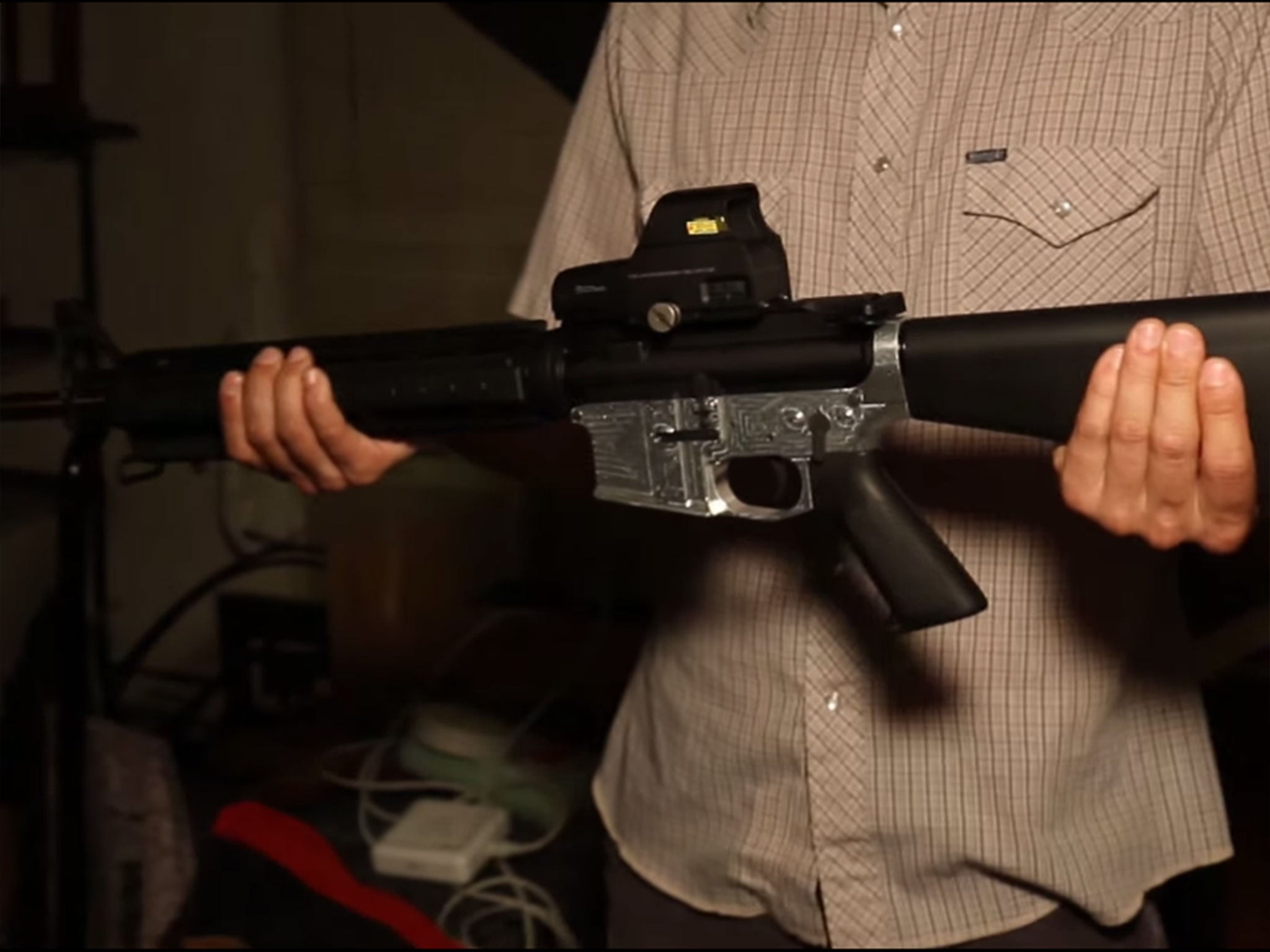 A lower receiver created using the Ghost Gunner machine, with gun accessories attached