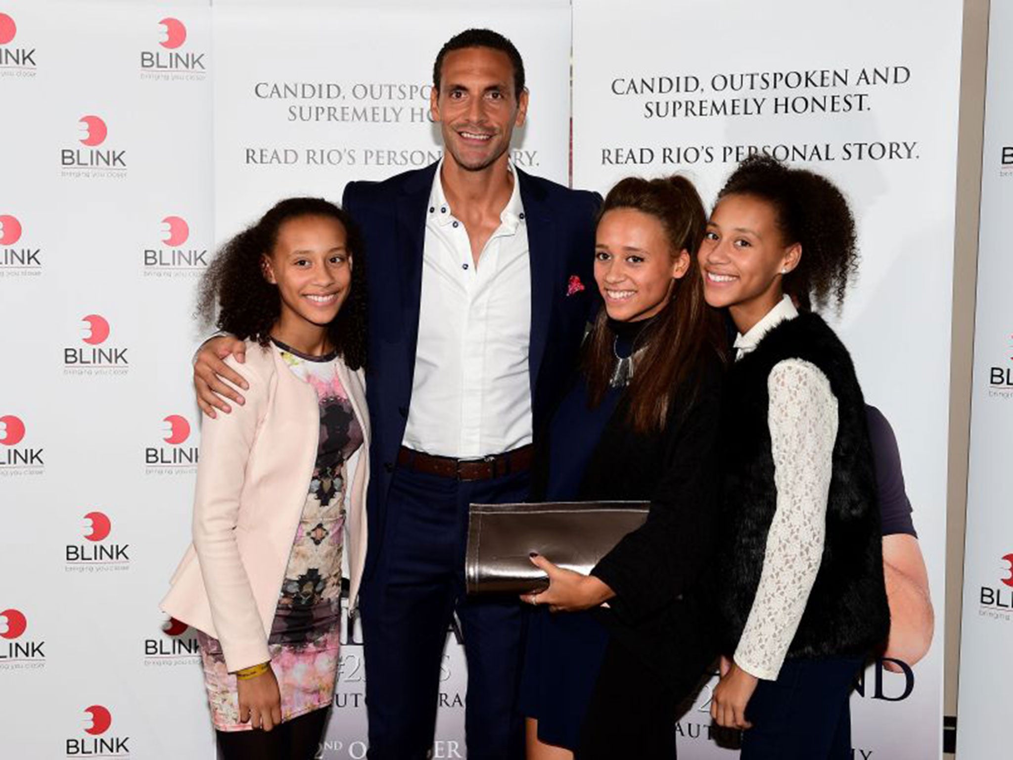 Rio Ferdinand with his step-sisters at the launch of his book at the May Fair Hotel, London