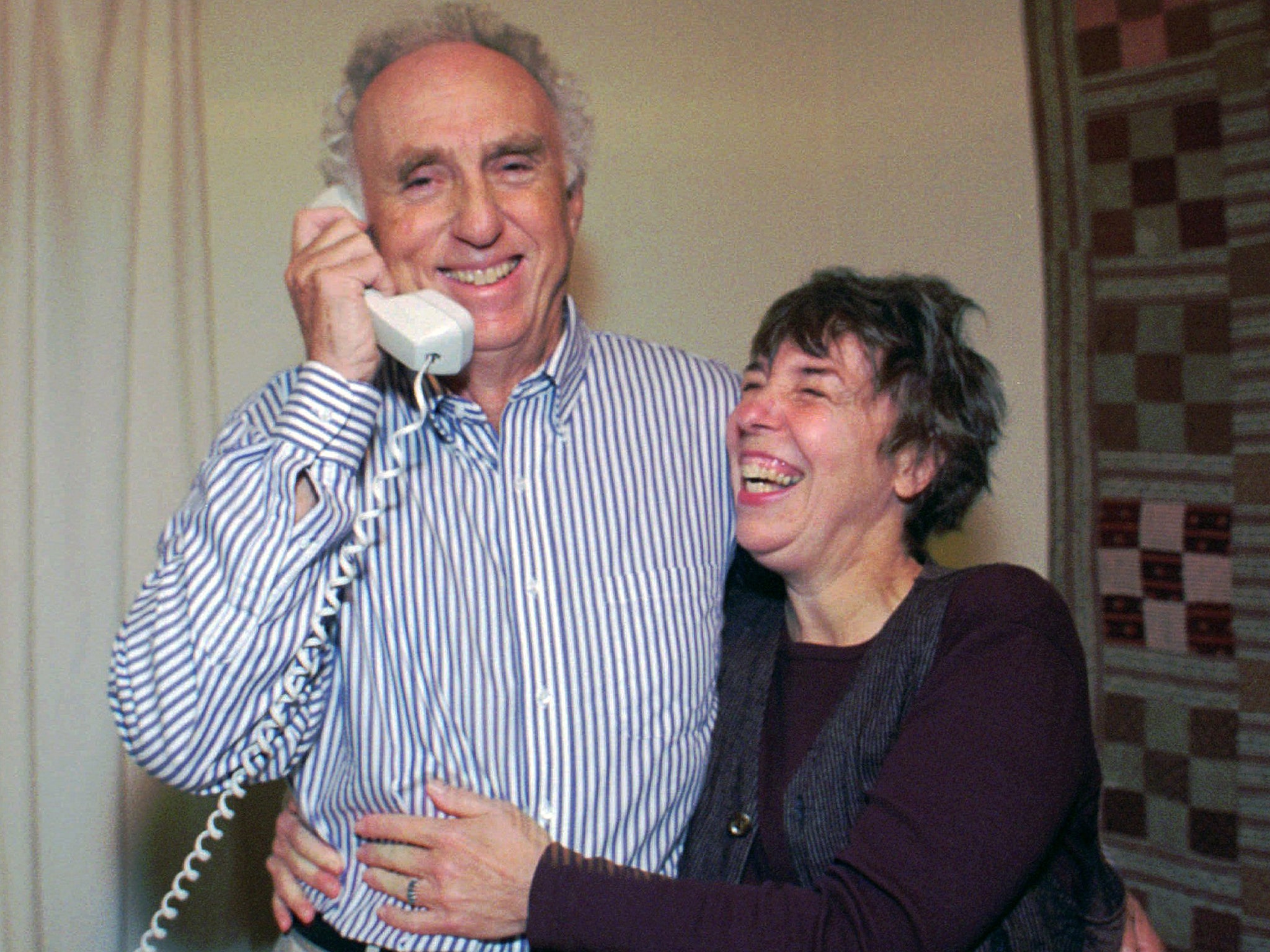 Perl with his wife receiving a congratulatory phone call following the news of his Nobel Prize win