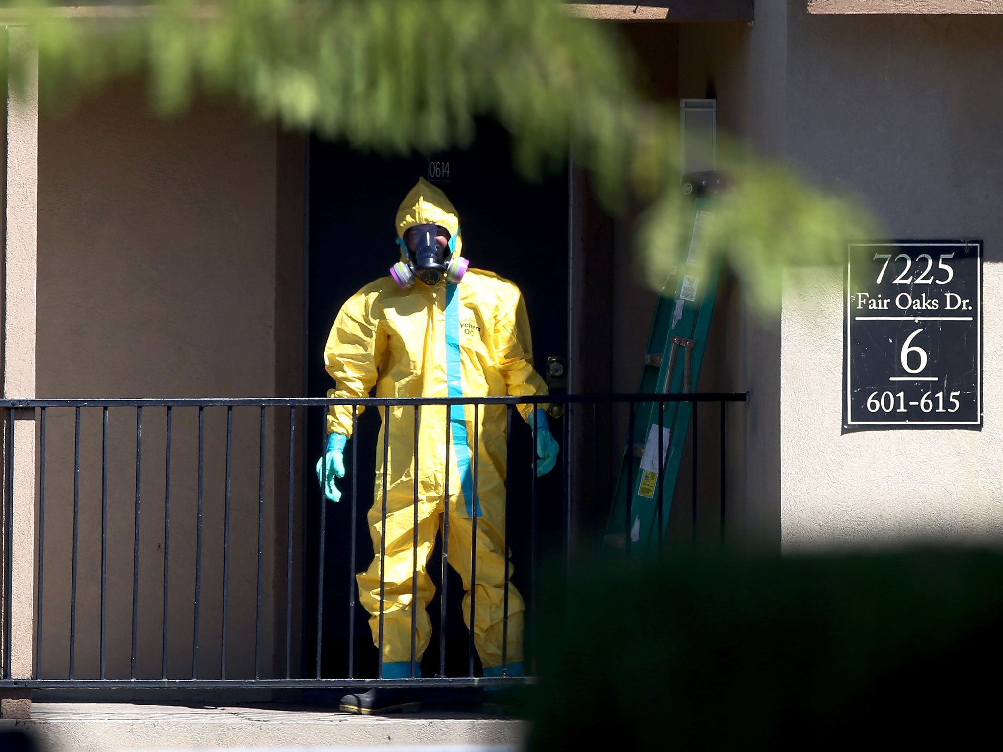 A hazmat team member arrives to clean a unit at the Ivy Apartments, where the confirmed Ebola virus patient was staying, on October 3, 2014 in Dallas, Texas.