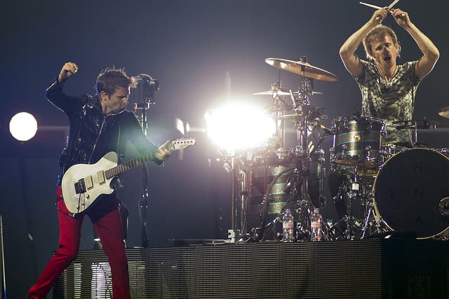 Muse's Matt Bellamy and Dominic Howard perform at the Amsterdam Arena in 2013