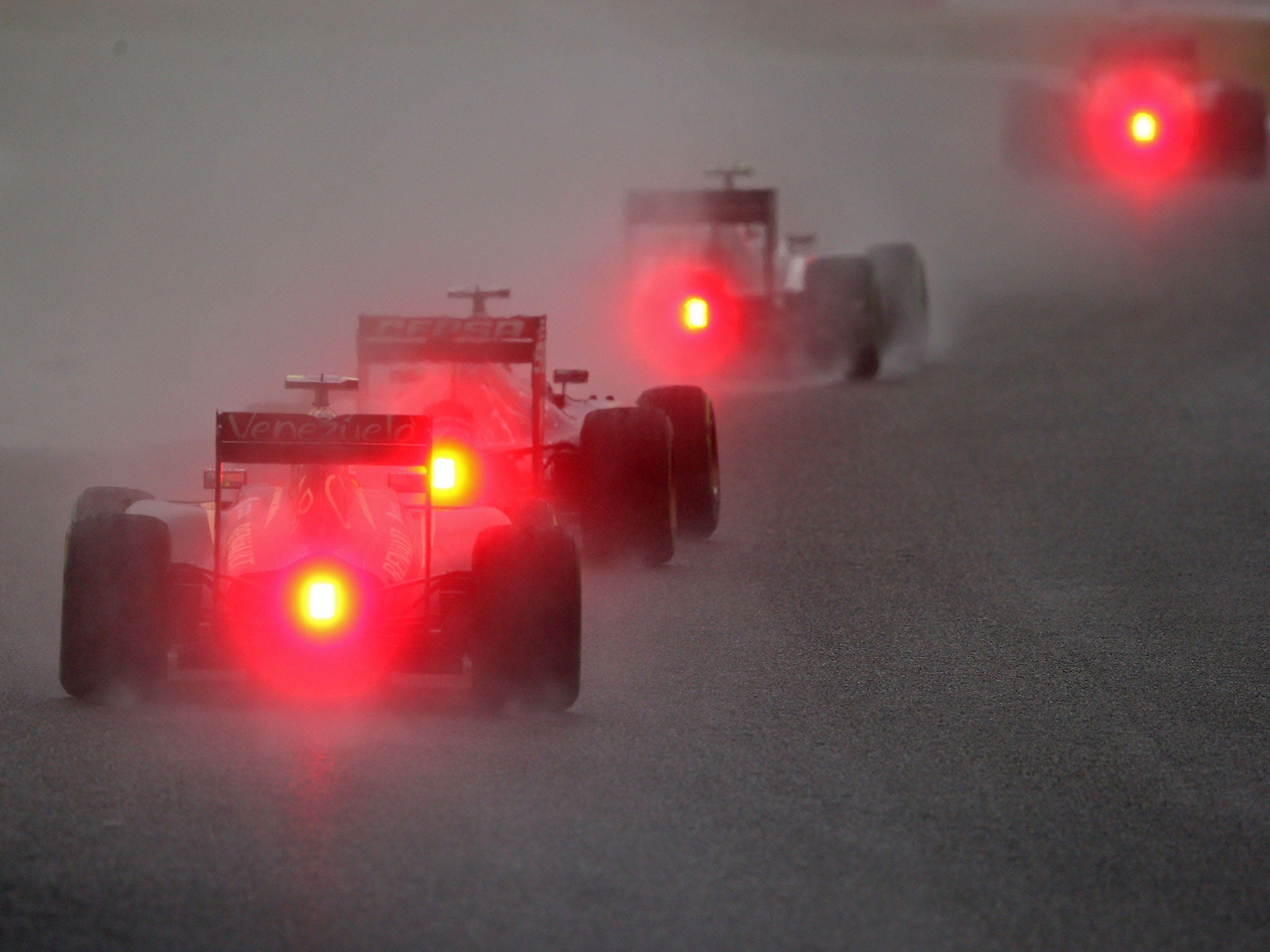 A general view of the drivers Adrian Sutil of Germany and Sauber F1 they battle against atrocious conditions during the Japanese Formula One Grand Prix