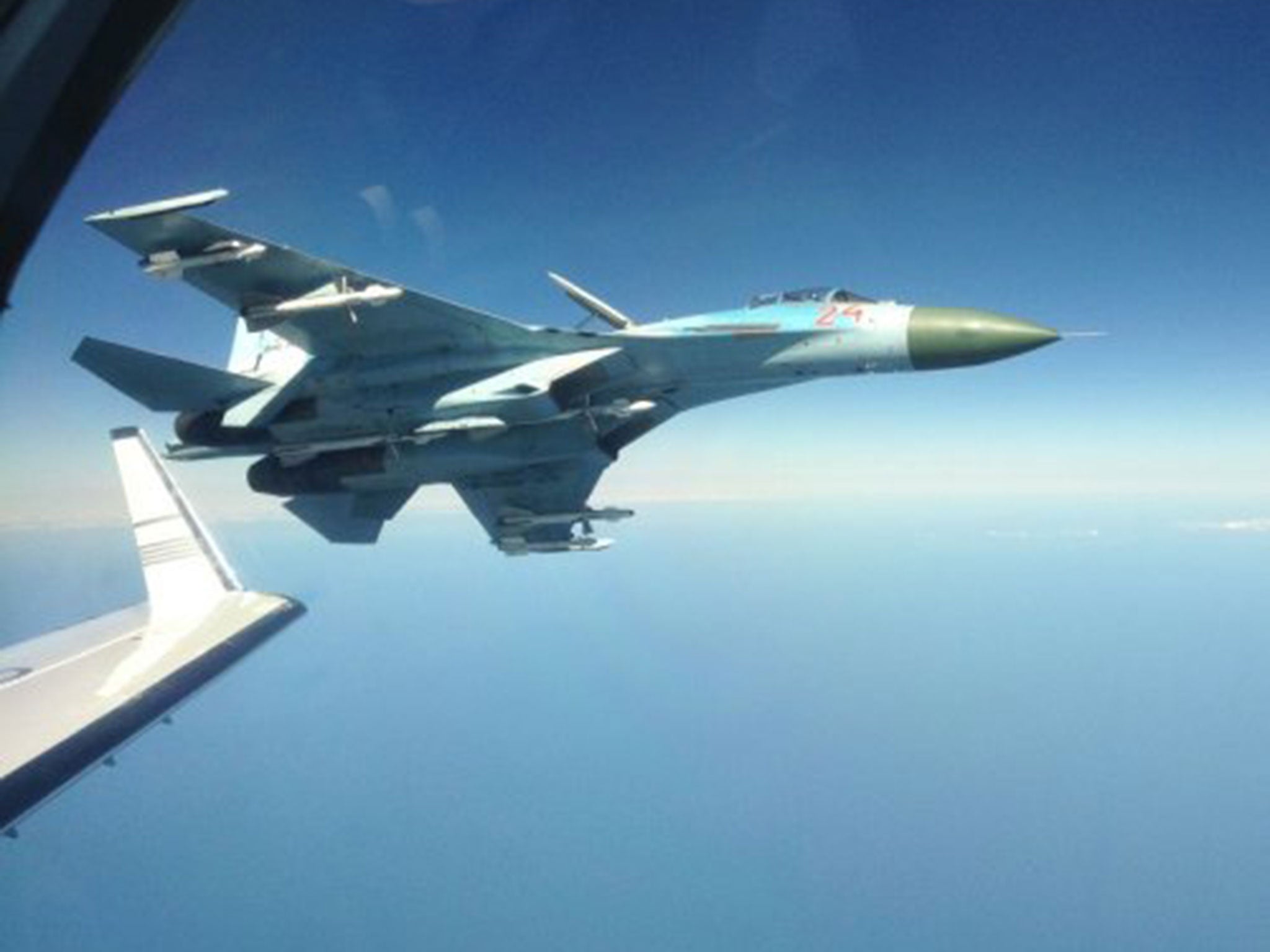 A Russian su-27 fighter jet photographed next to a Swedish intelligence plane in 2014