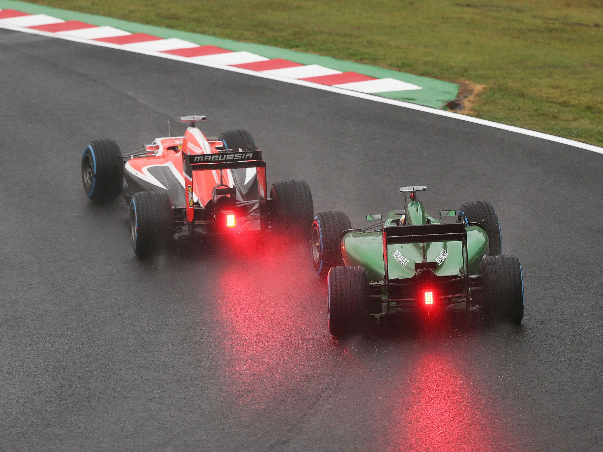 Jules Bianchi and Romain Grosjean battle for position during the Japanese Formula One Grand Prix at Suzuka Circuit