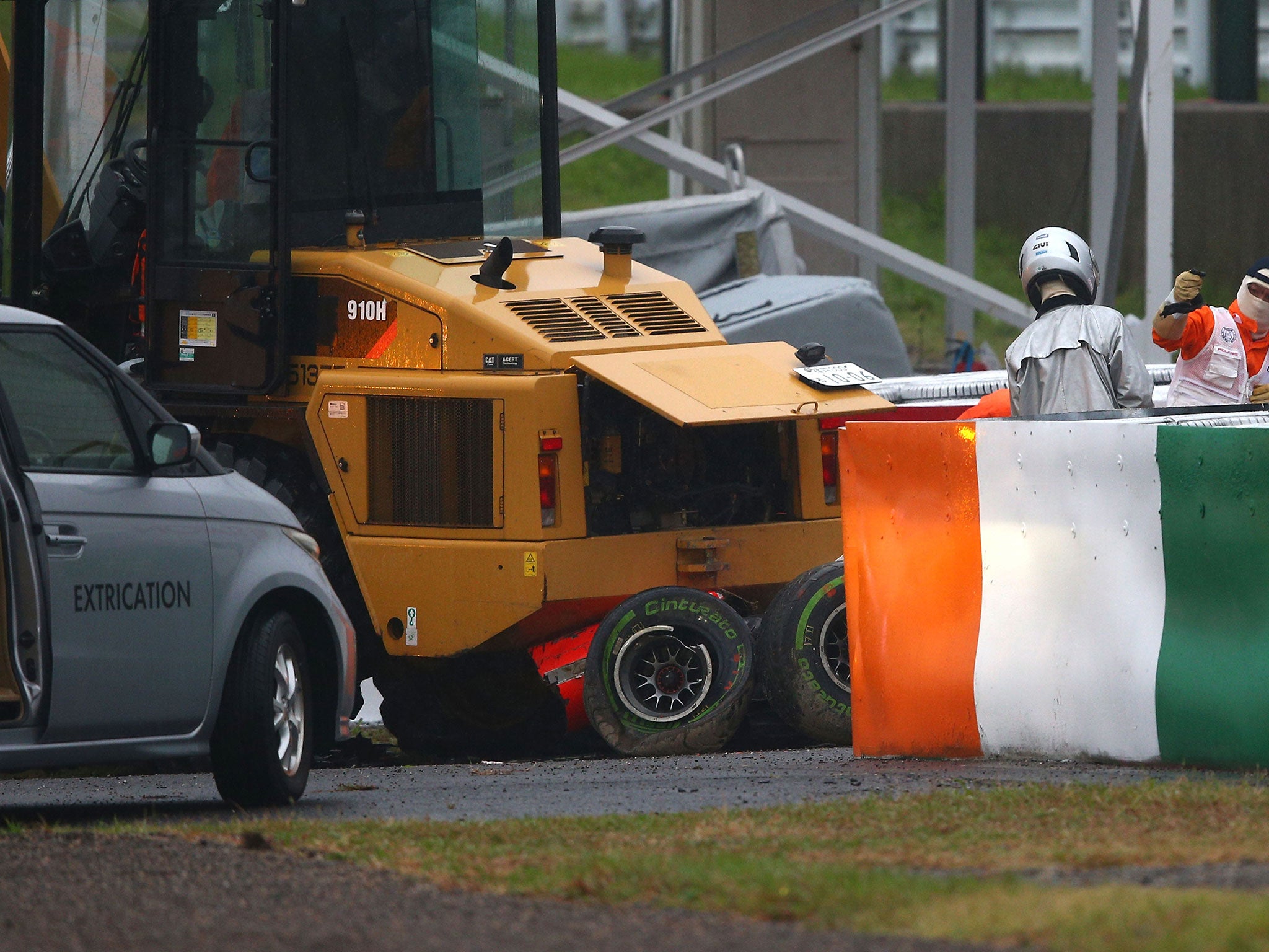Marussia driver Jules Bianchi receives urgent medical treatment after crashing during the Japanese Grand Prix