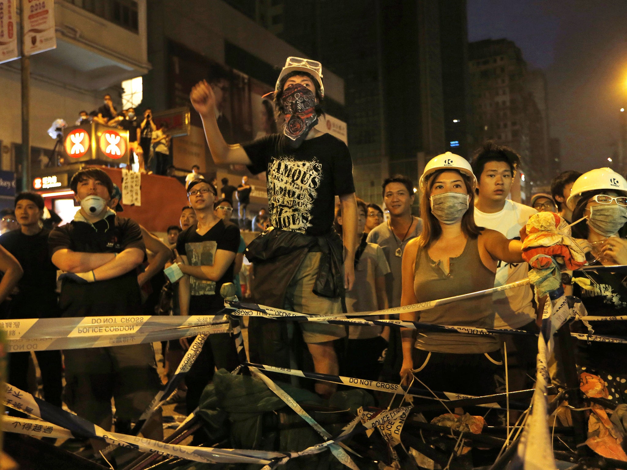Pro-democracy demonstrators occupy a street in the Mong Kok district of Hong Hong, where some locals have objected to their presence and violence involving Triad gangs has erupted