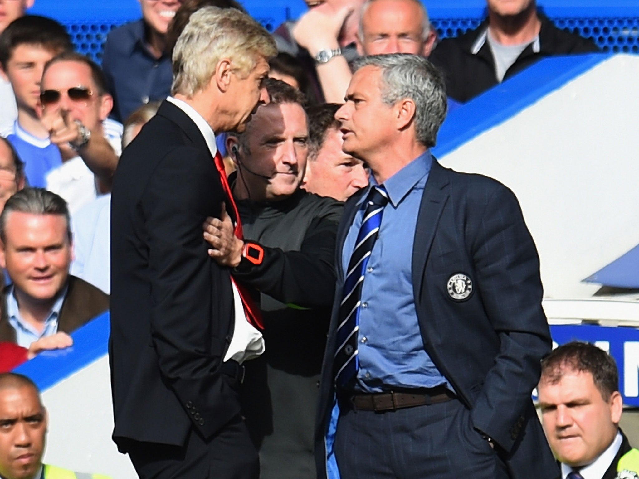 Arsene Wenger and Jose Mourinho are separated by the fourth official