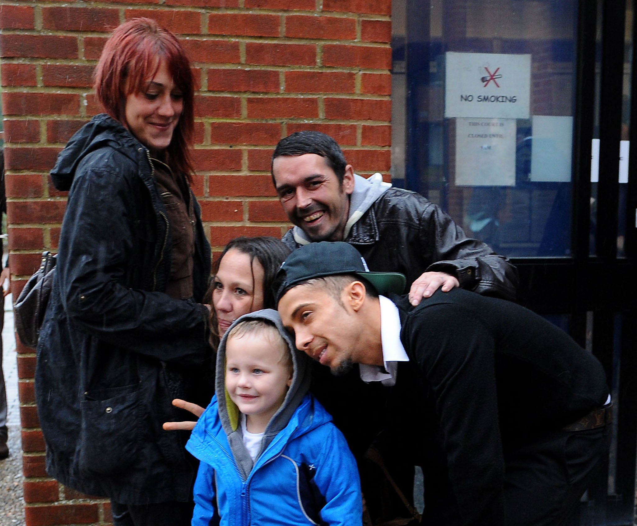 Dappy posed with fans outside Reading Magistrates' Court after his sentencing for nightclub assault was adjourned.